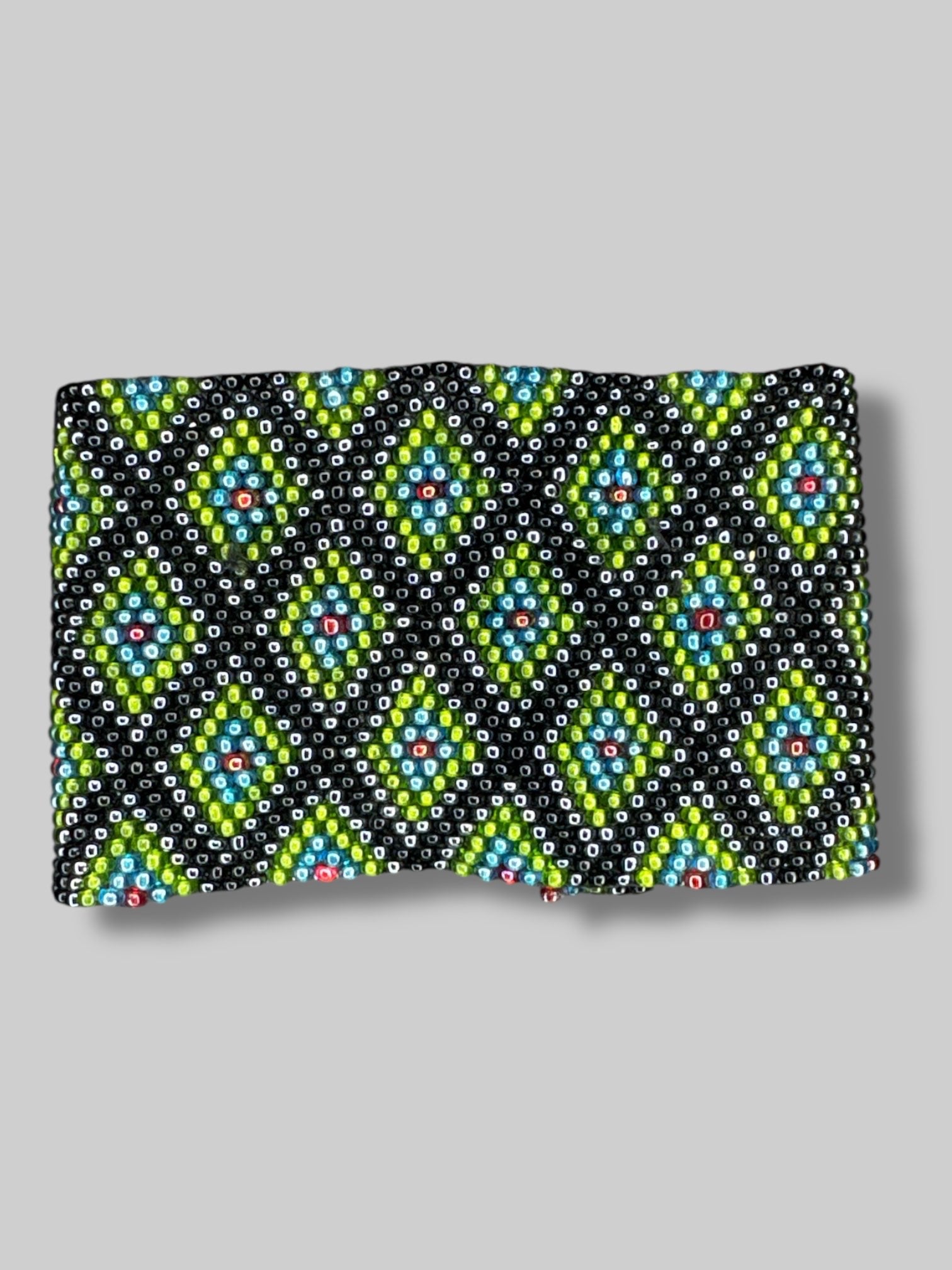 7” long unclasped beautiful green, blue, black, and red beaded bracelet