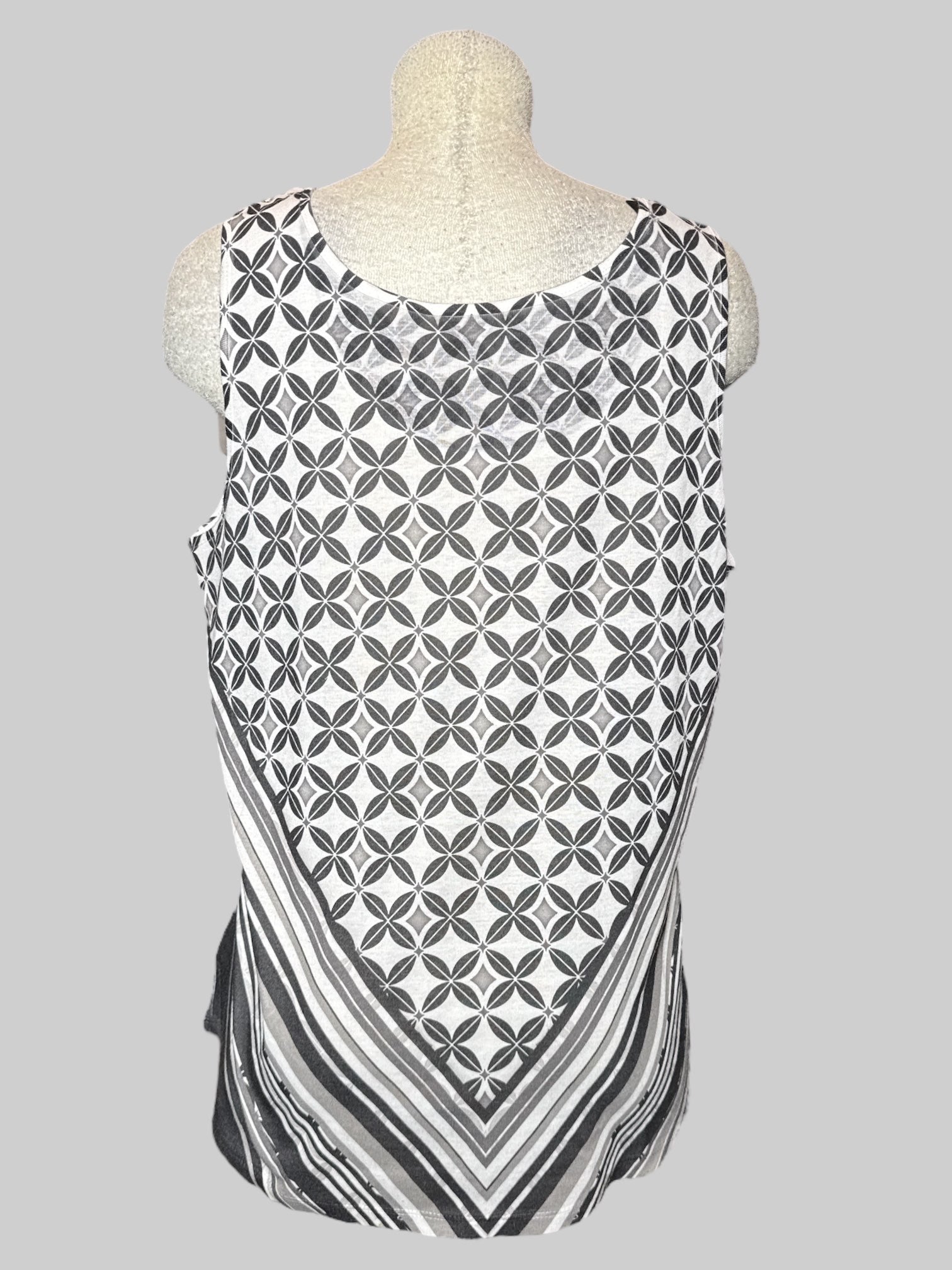 1X white sleeveless top with geometric and chevron patterns