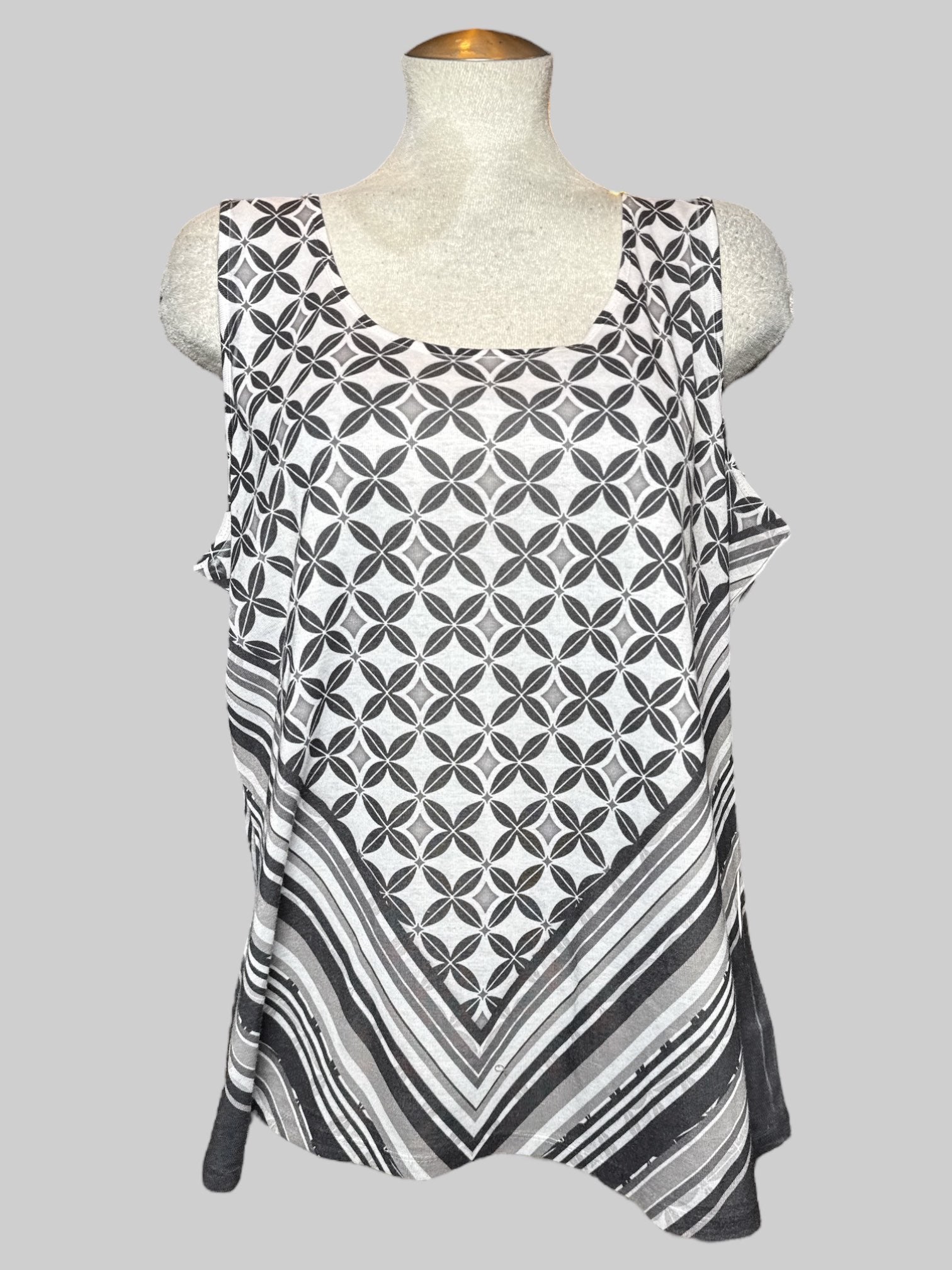 1X white sleeveless top with geometric and chevron patterns