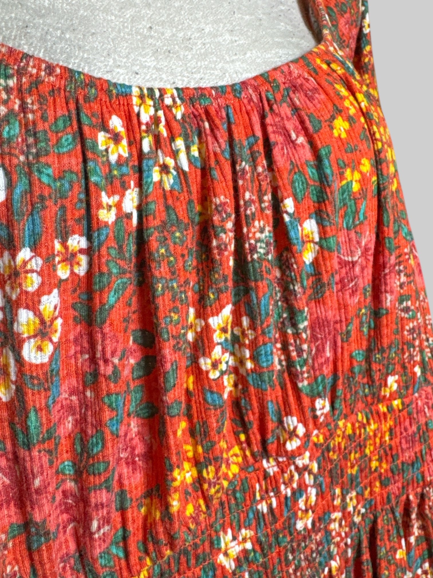 3X Torrid orangey pink top with multicolor florals, a shirred waist, and balloon sleeves