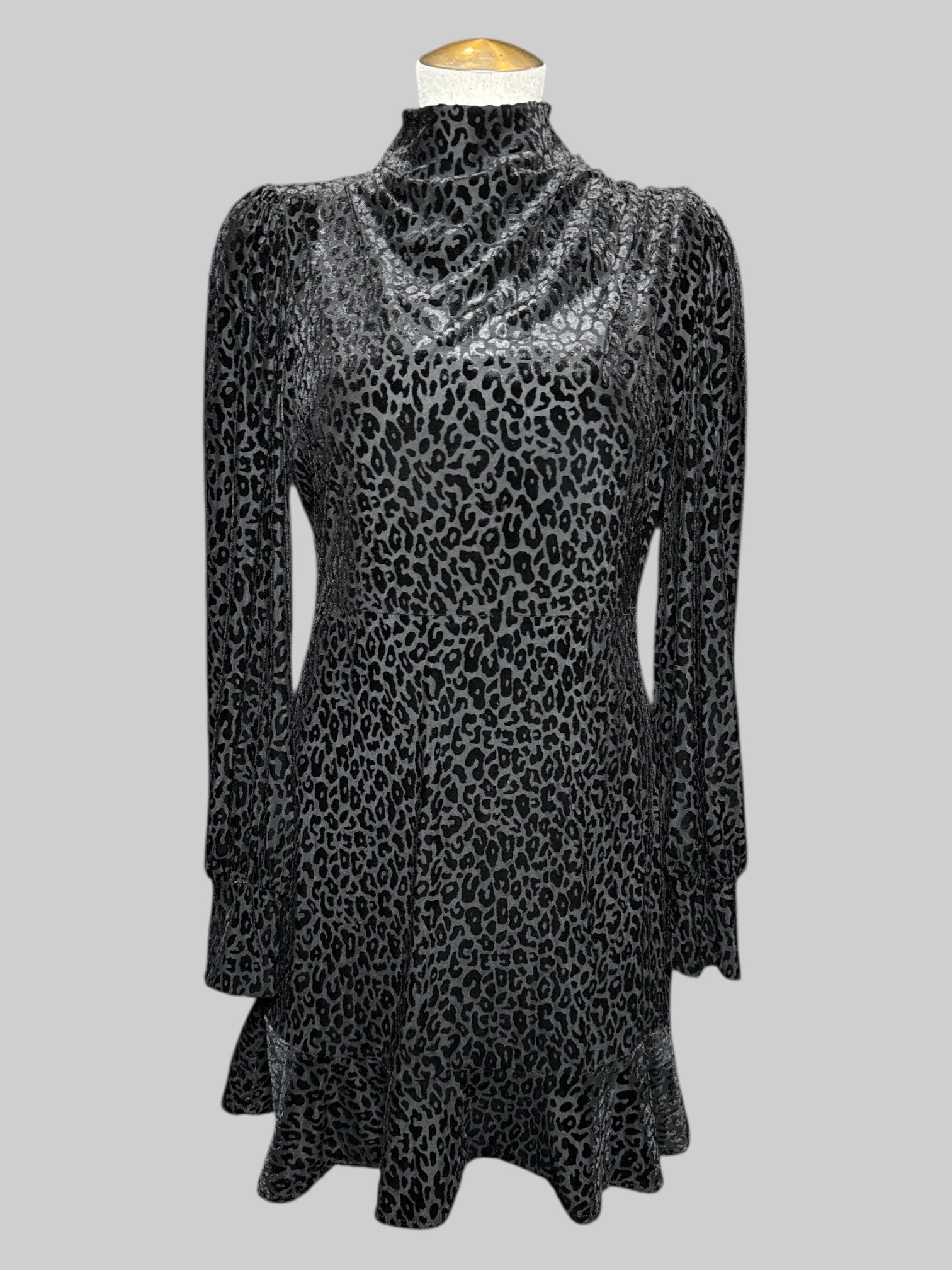 S Express black long sleeve dress with black velvet burn out leopard print, pleated right shoulder, and ruffle hem