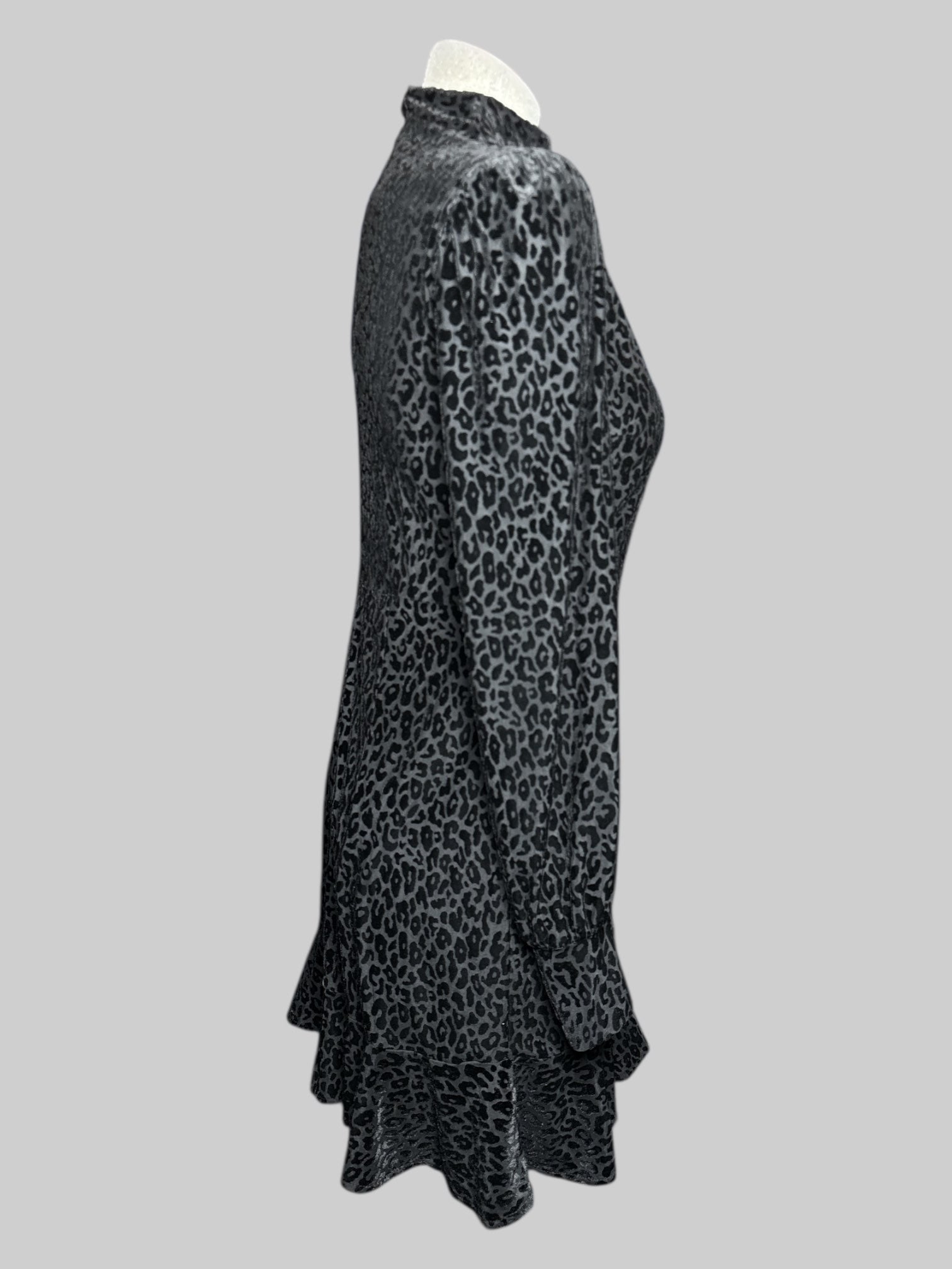 S Express black long sleeve dress with black velvet burn out leopard print, pleated right shoulder, and ruffle hem