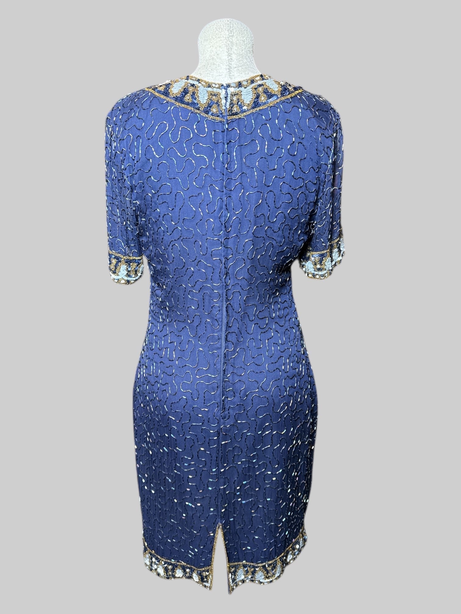 M vintage navy blue short sleeve dress with squiggly iridescent beading all over, sheer sleeves, and sequins designs on hems and cuffs