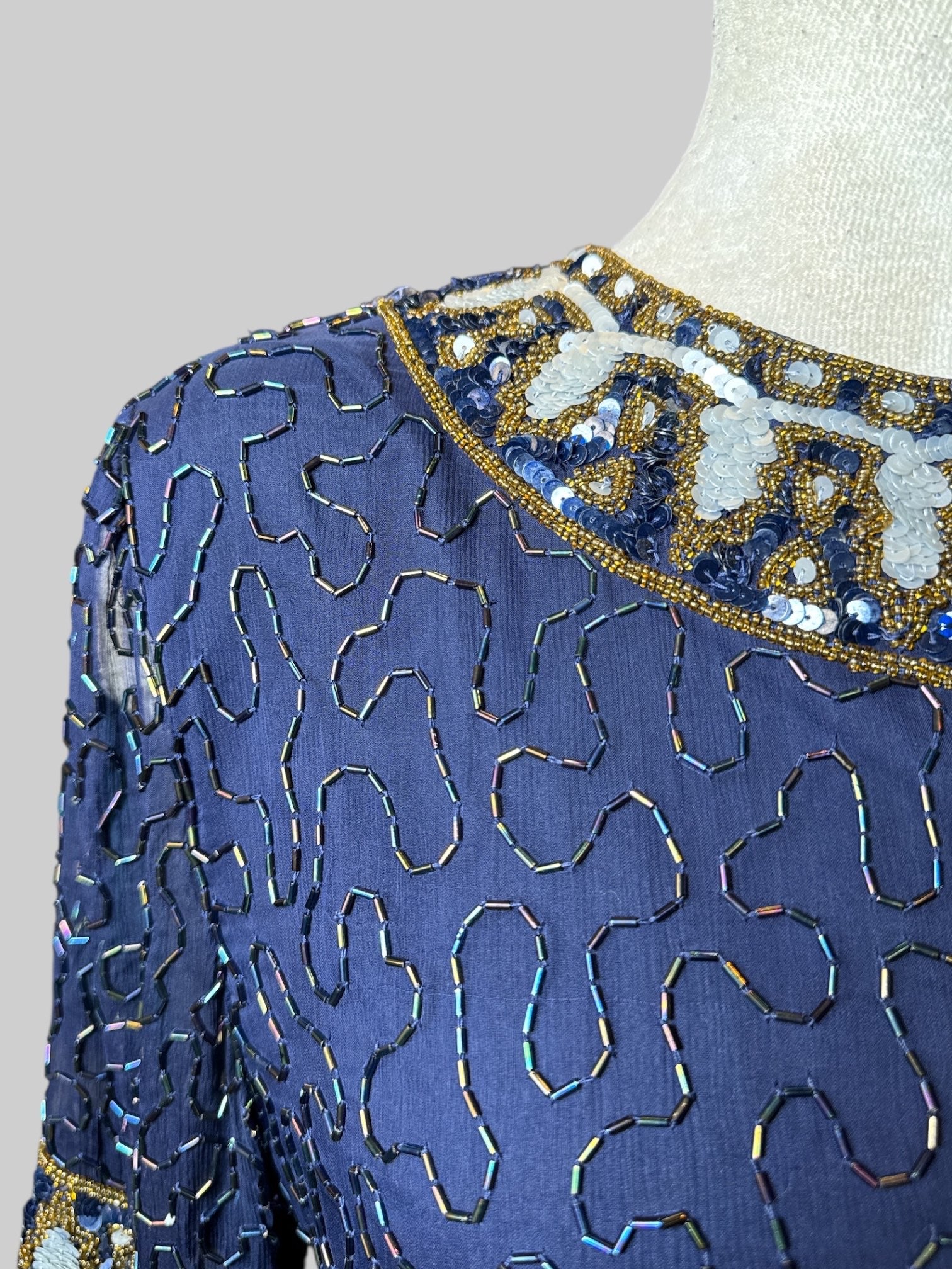 M vintage navy blue short sleeve dress with squiggly iridescent beading all over, sheer sleeves, and sequins designs on hems and cuffs