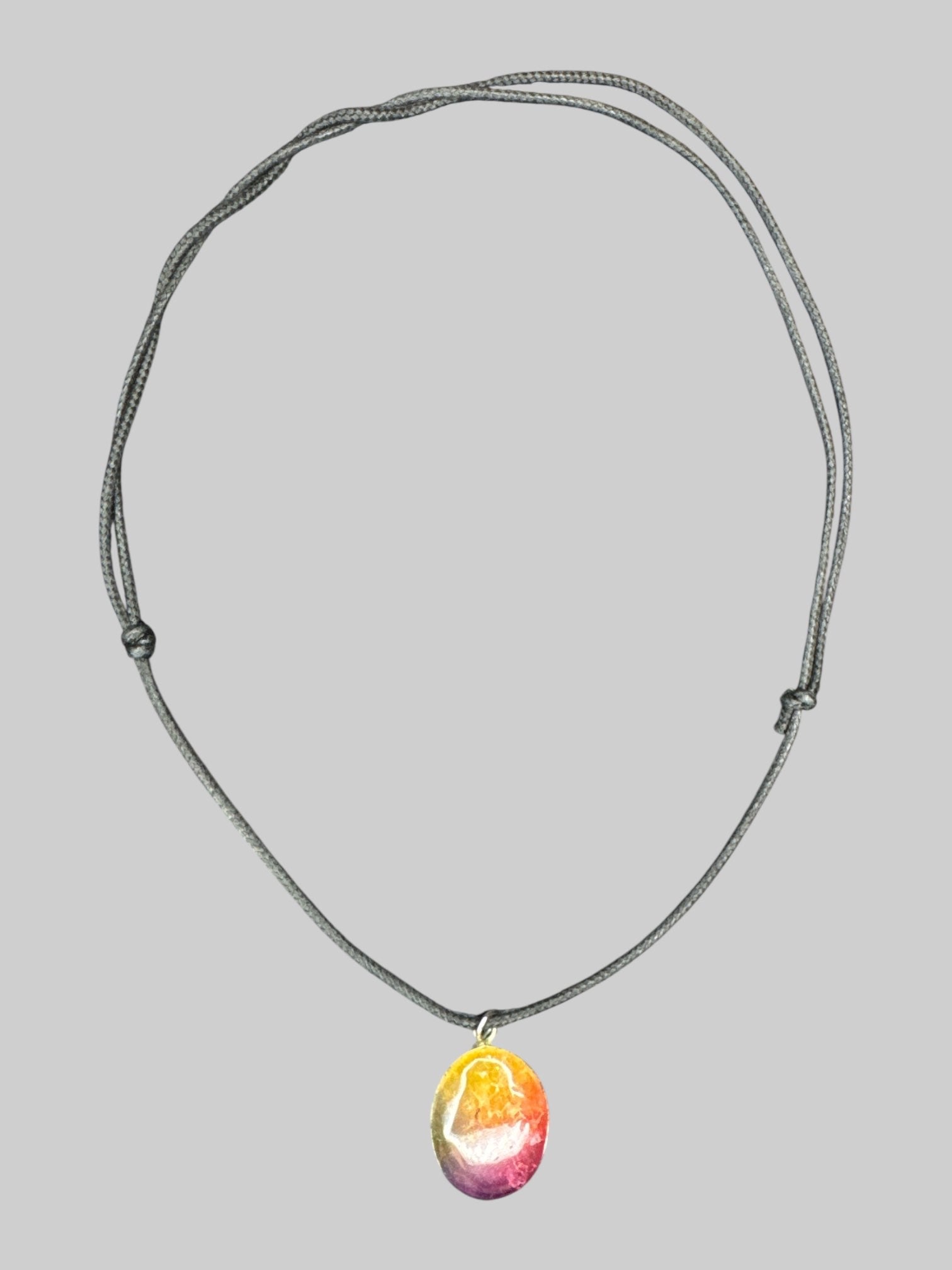 Rainbow colored stone necklace with adjustable rope