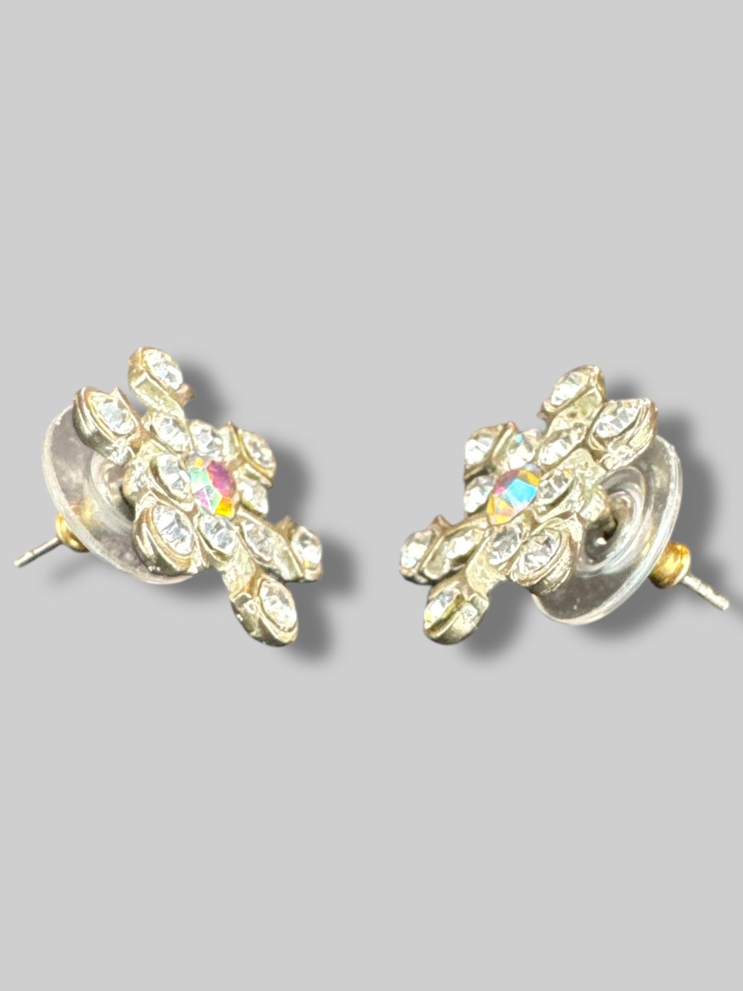 Bedazzled snowflake earrings with iridescent gem in middle