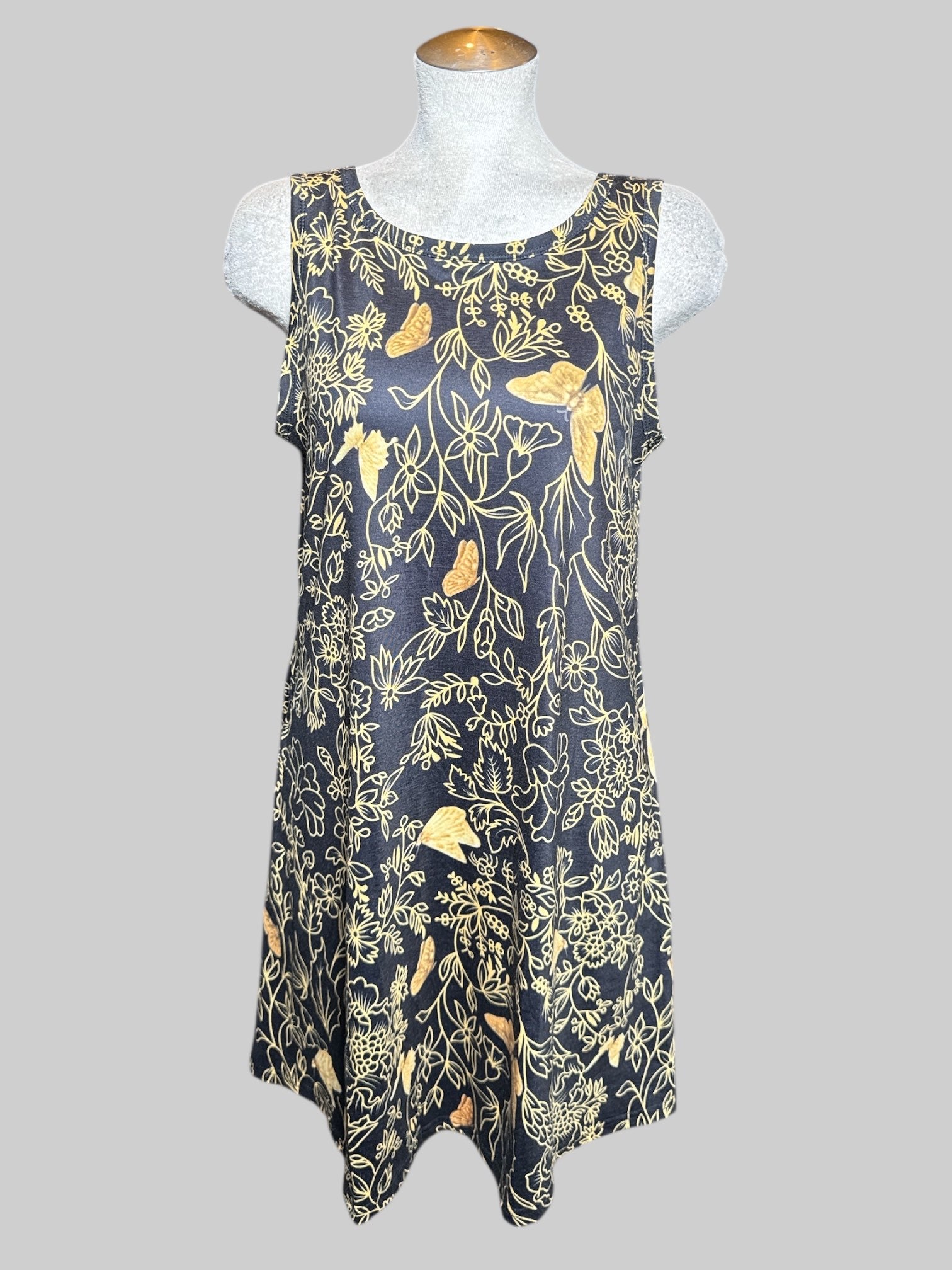 L black sleeveless dress with gold colored florals with butterflies, and pockets