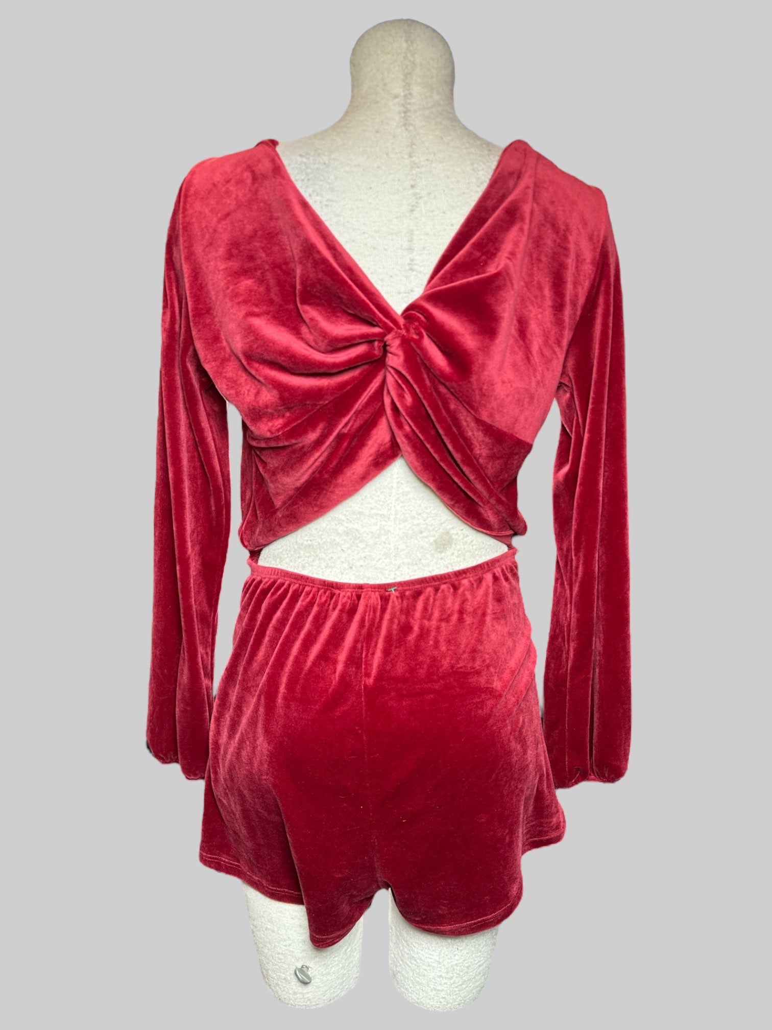 L Blue Blush red velvet romper with open back, tie in front, and elastic waistband