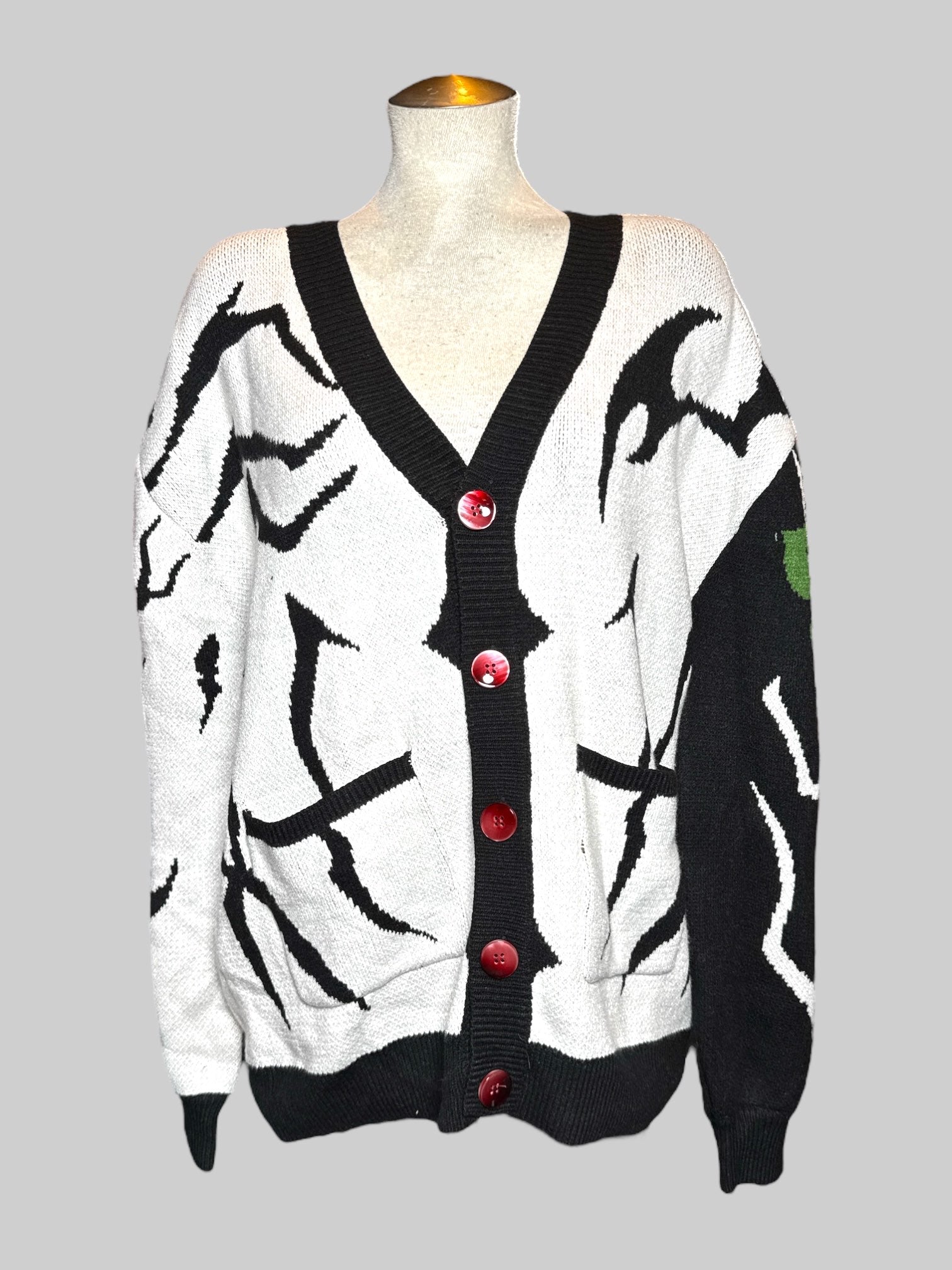 0X Steady Hands black and white cardigan with black sleeve and buttons