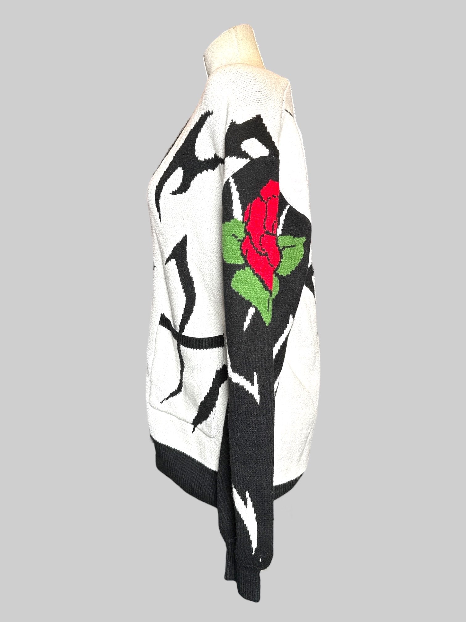 0X Steady Hands black and white cardigan with black sleeve and buttons