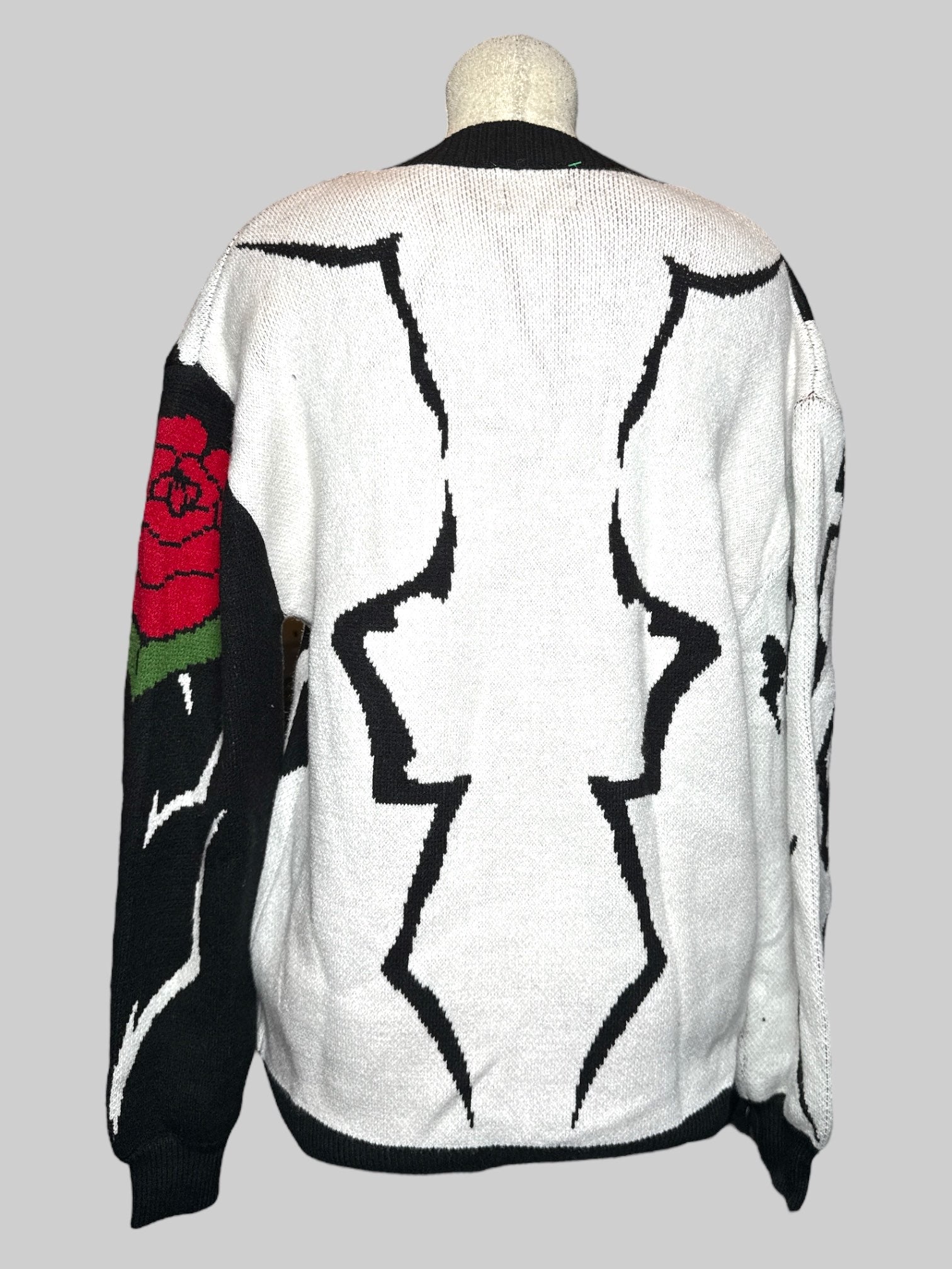 0X Steady Hands black and white cardigan with black sleeve and buttons