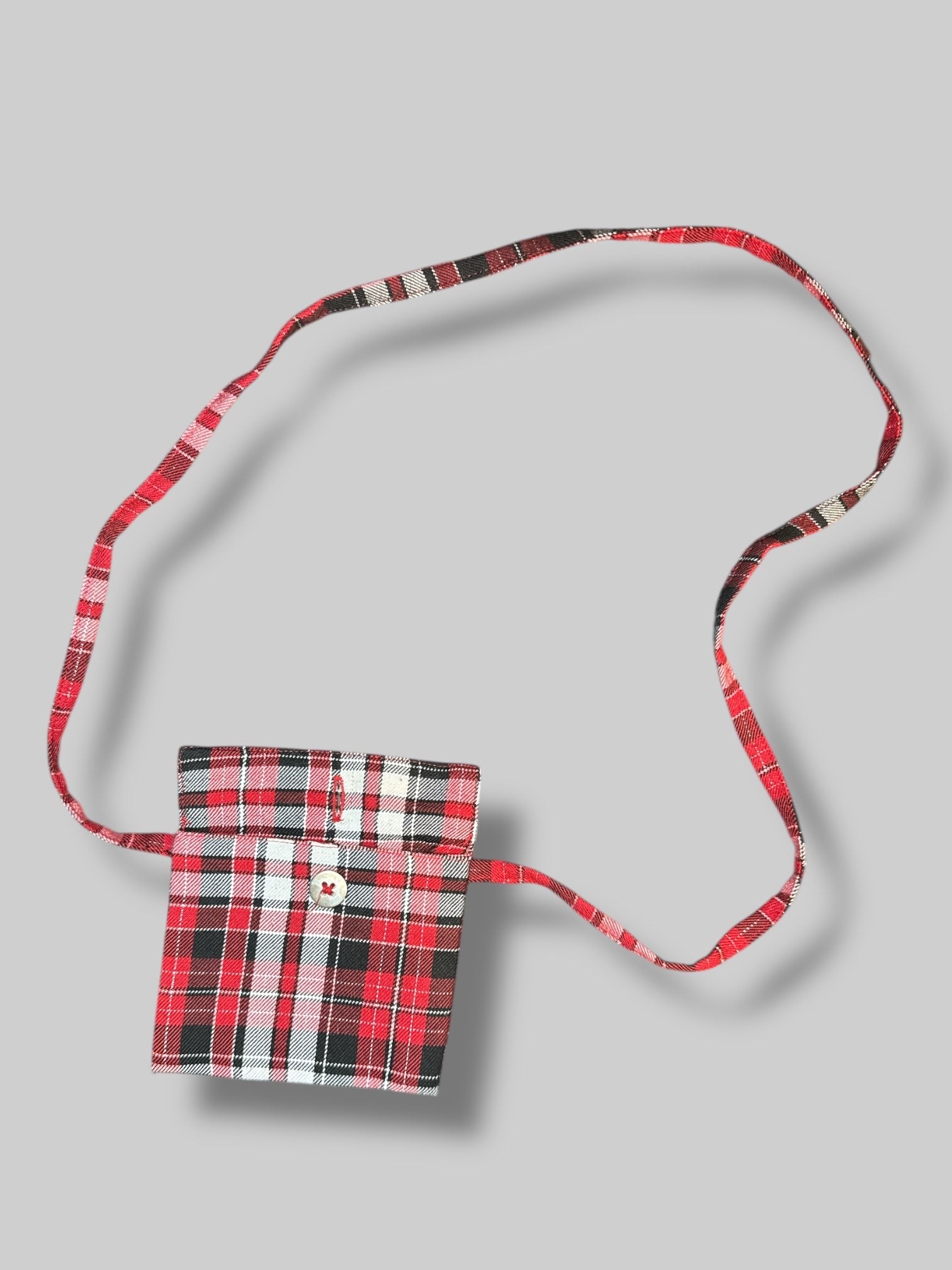 4.5’ little green, white, red, black, and metallic plaid purse with button