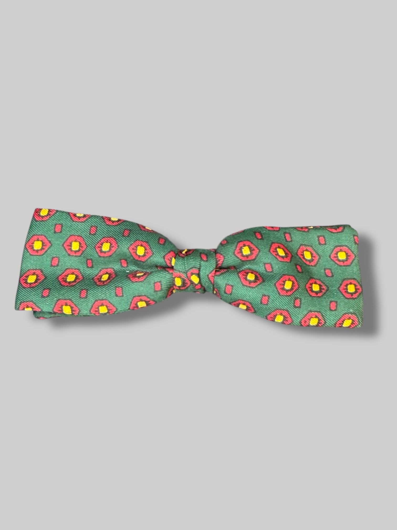 5’ green bow tie with red and yellow geometric pattern