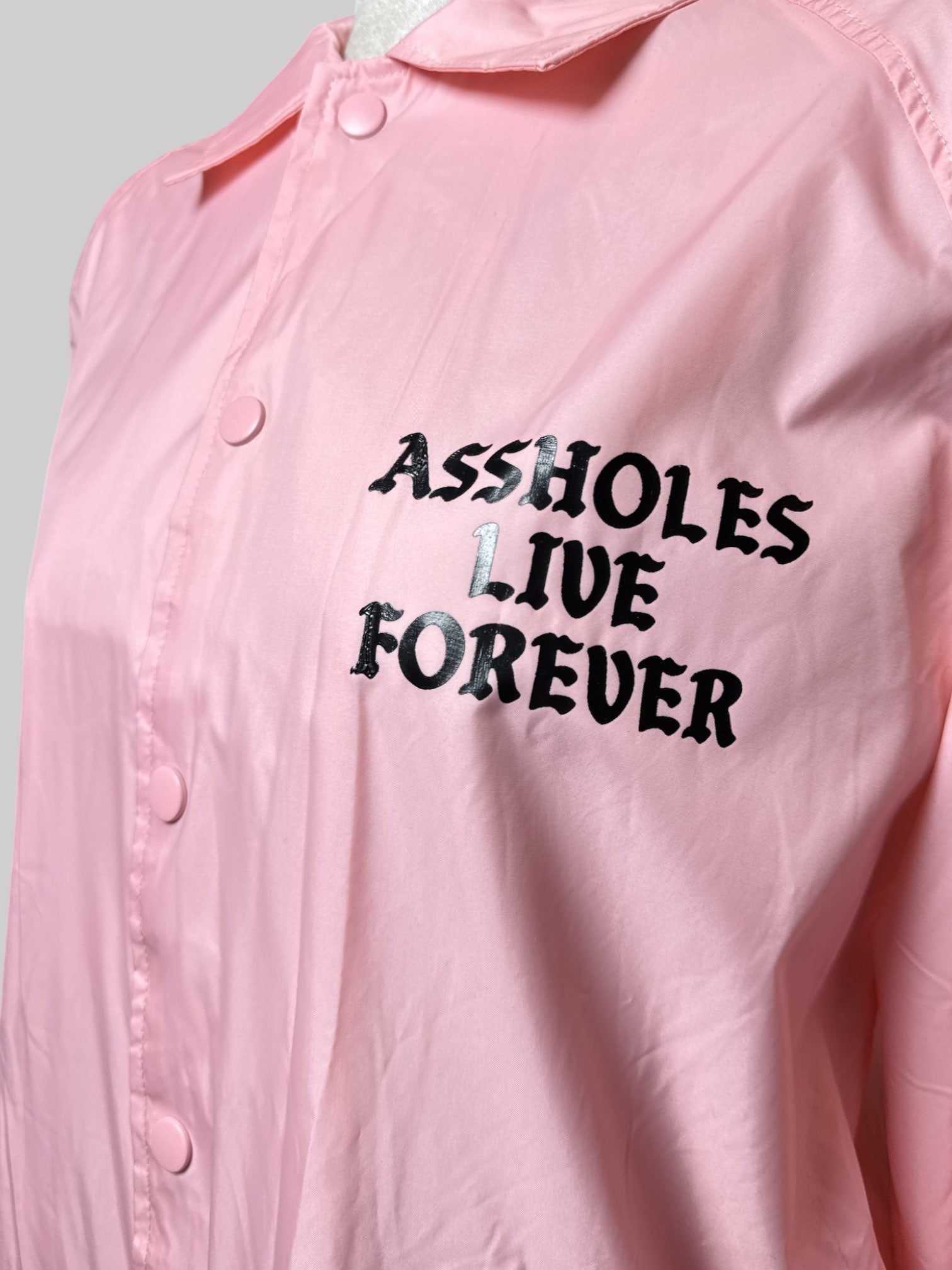 M Assholes Live Forever pink jacket with snap buttons