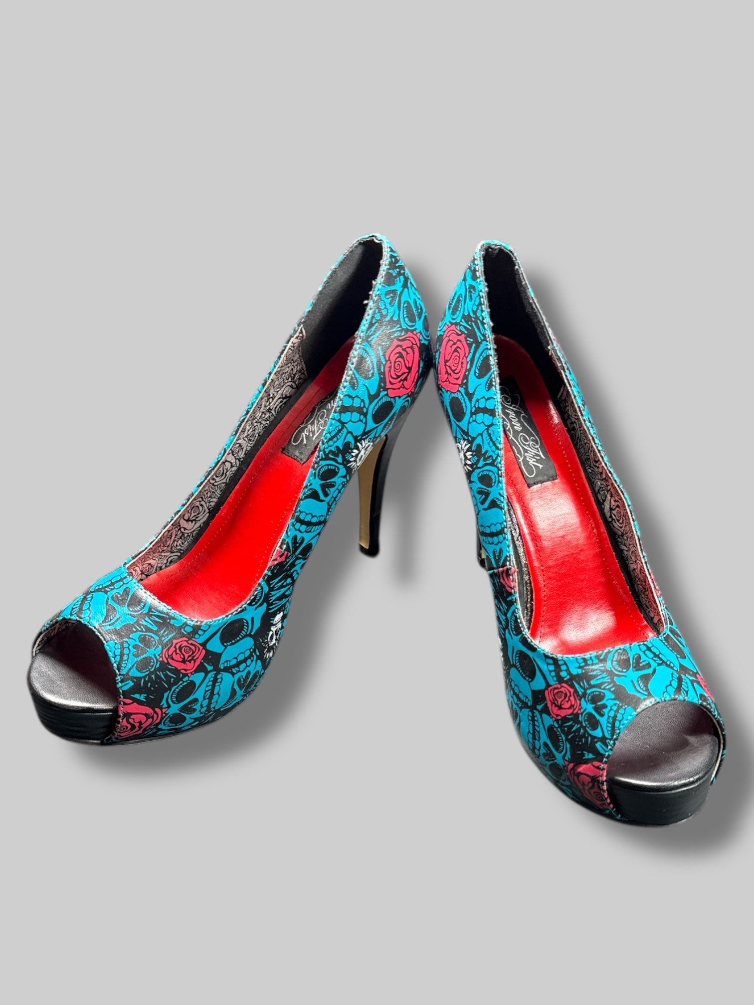 Size 42 Iron Fist blue and black skull pattern with roses and red and silver interior 5’ heels