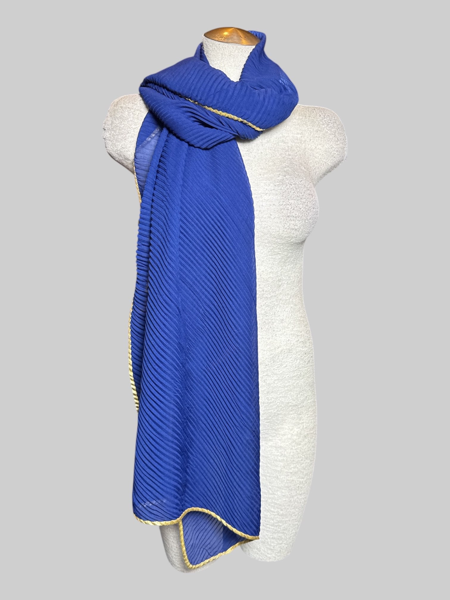 Blue ribbed scarf with gold color hem, about 100" long