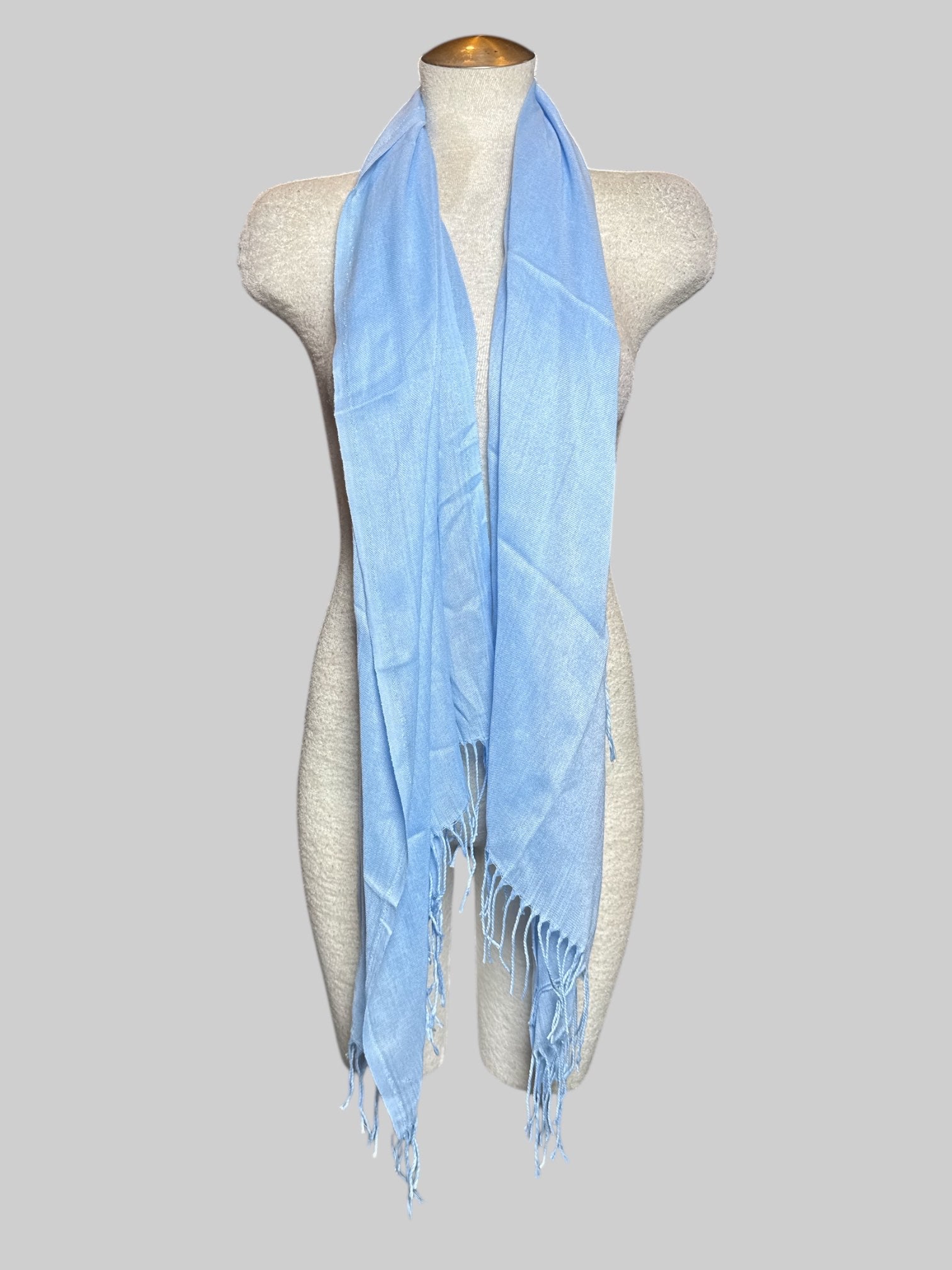 Light blue scarf with fringe, about 65’