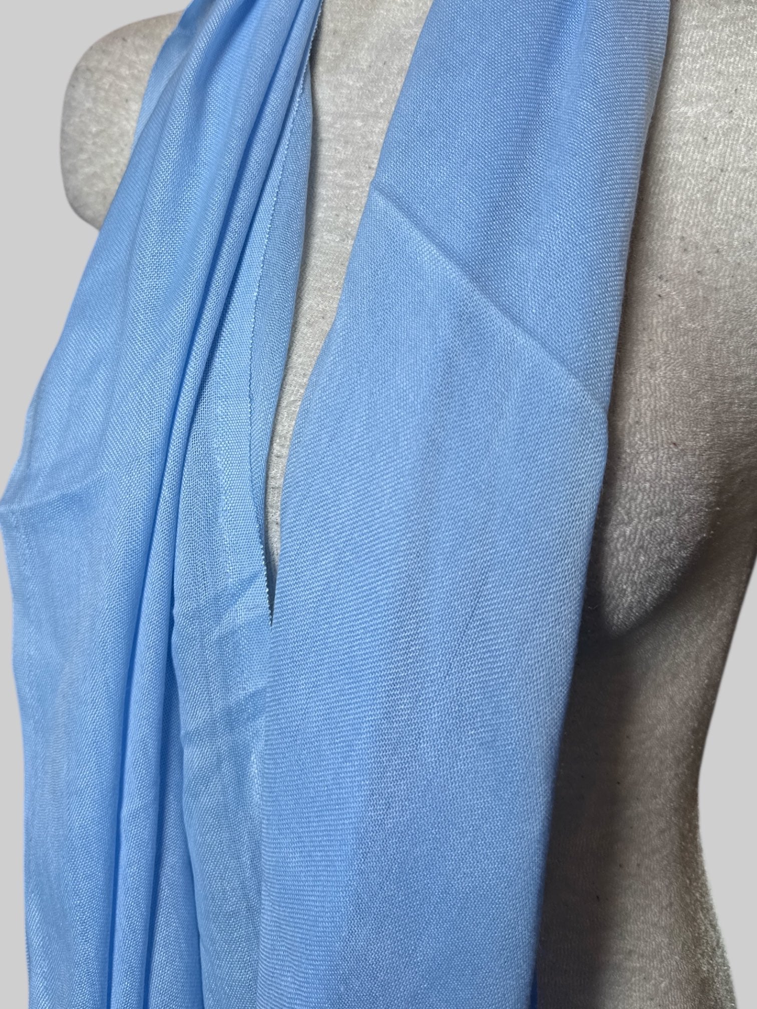 Light blue scarf with fringe, about 65’