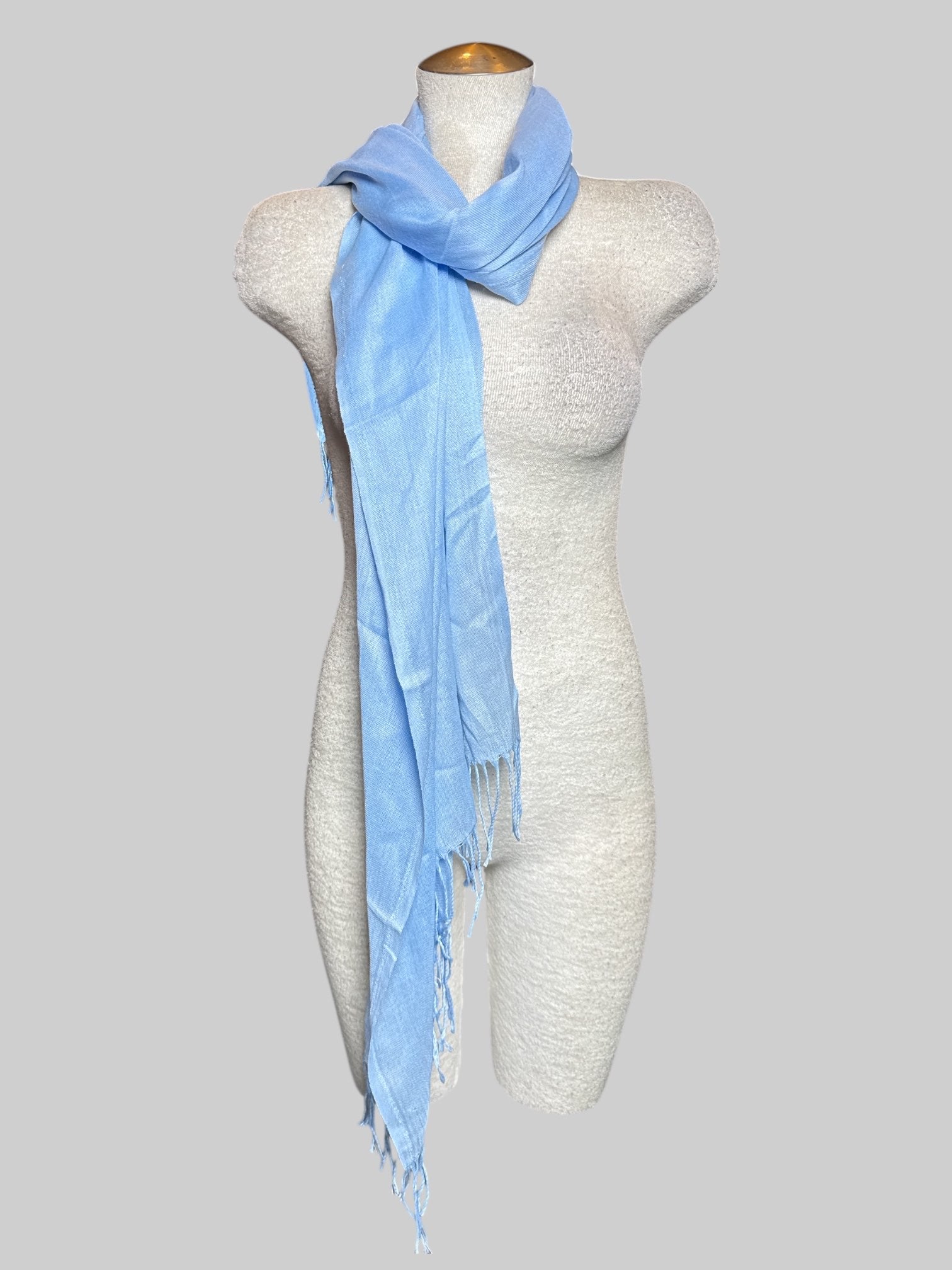 Light blue scarf with fringe, about 65’