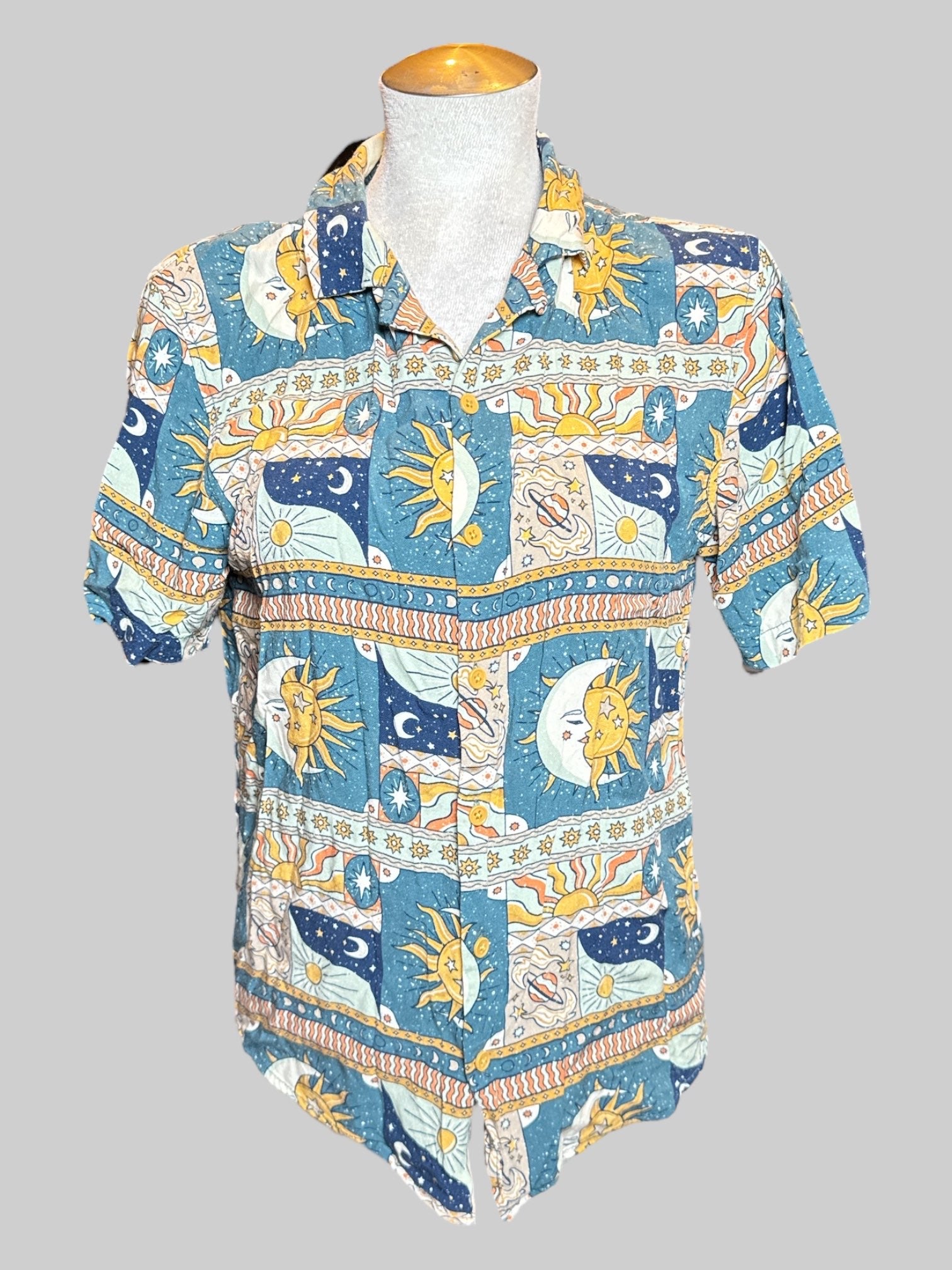 M Earthbound Trading Co teal short sleeve button down with celestial sun moon and planets design