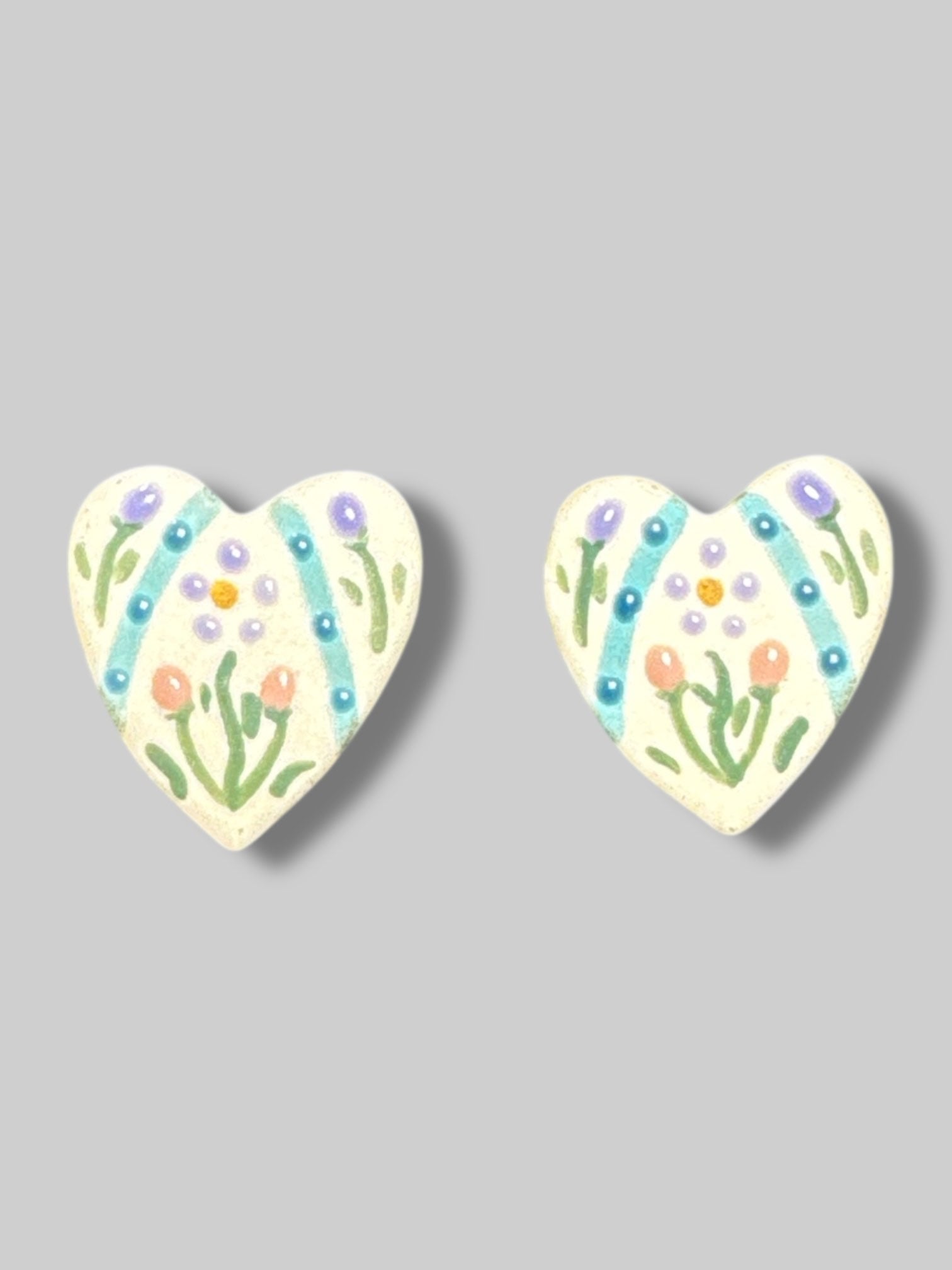 Handmade heart shaped earrings with florals