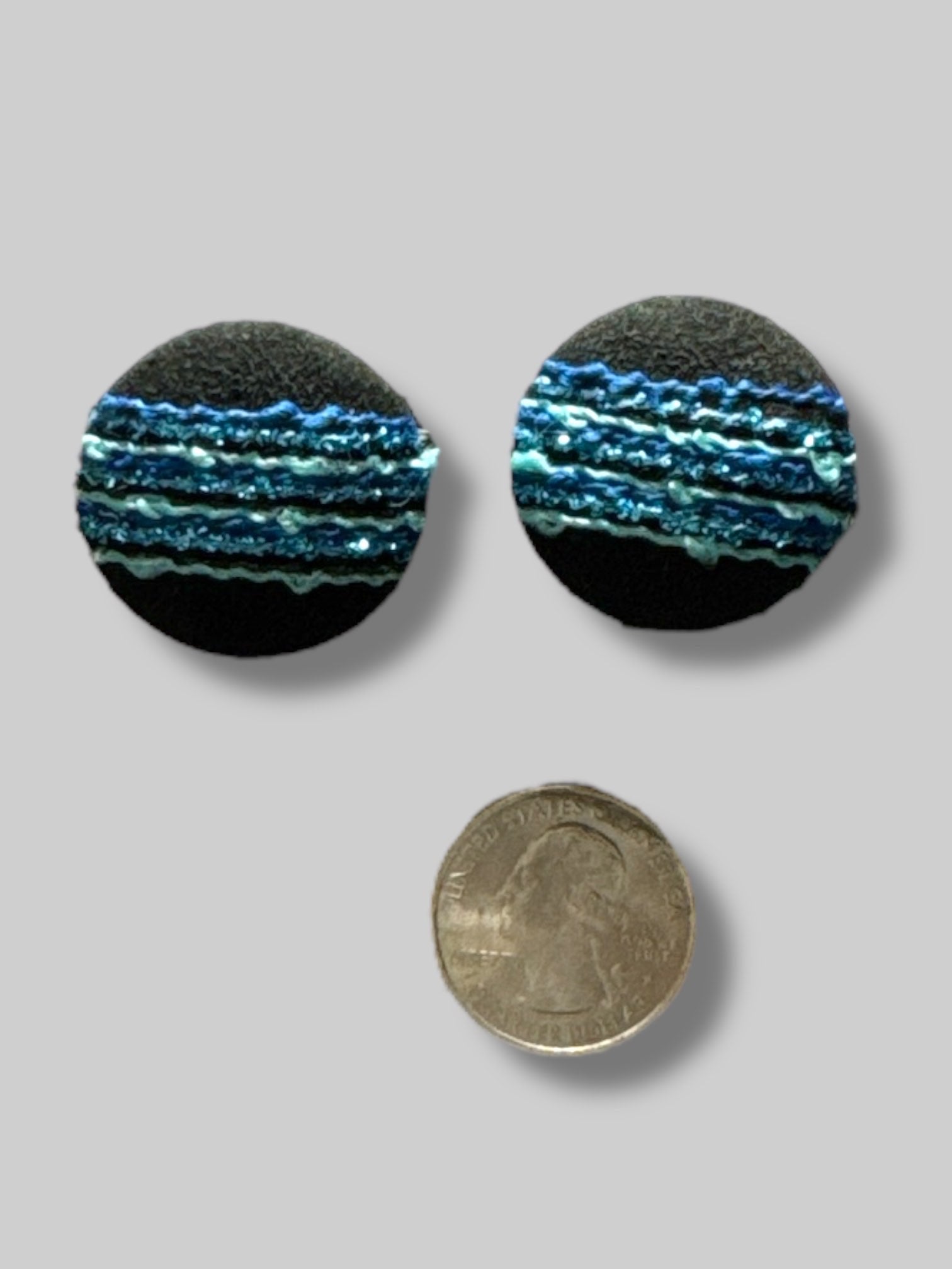round black fabric with blue and metallic threads earrings