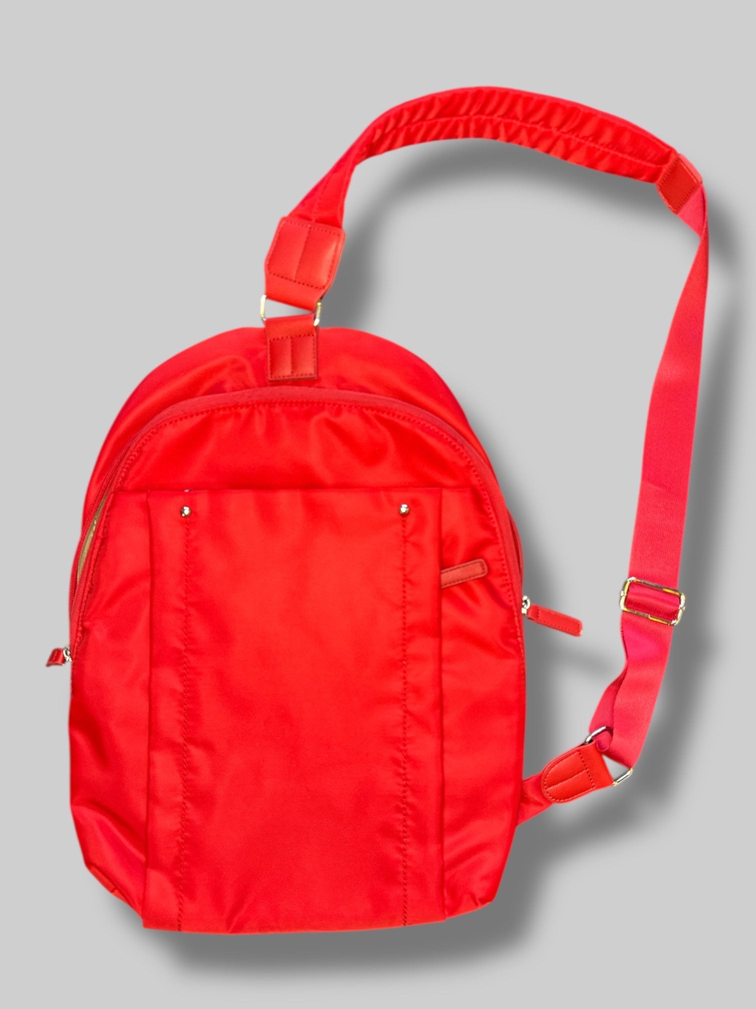 Francine Collections Red lightly padded laptop backpack with one adjustable strap and many zipper pockets