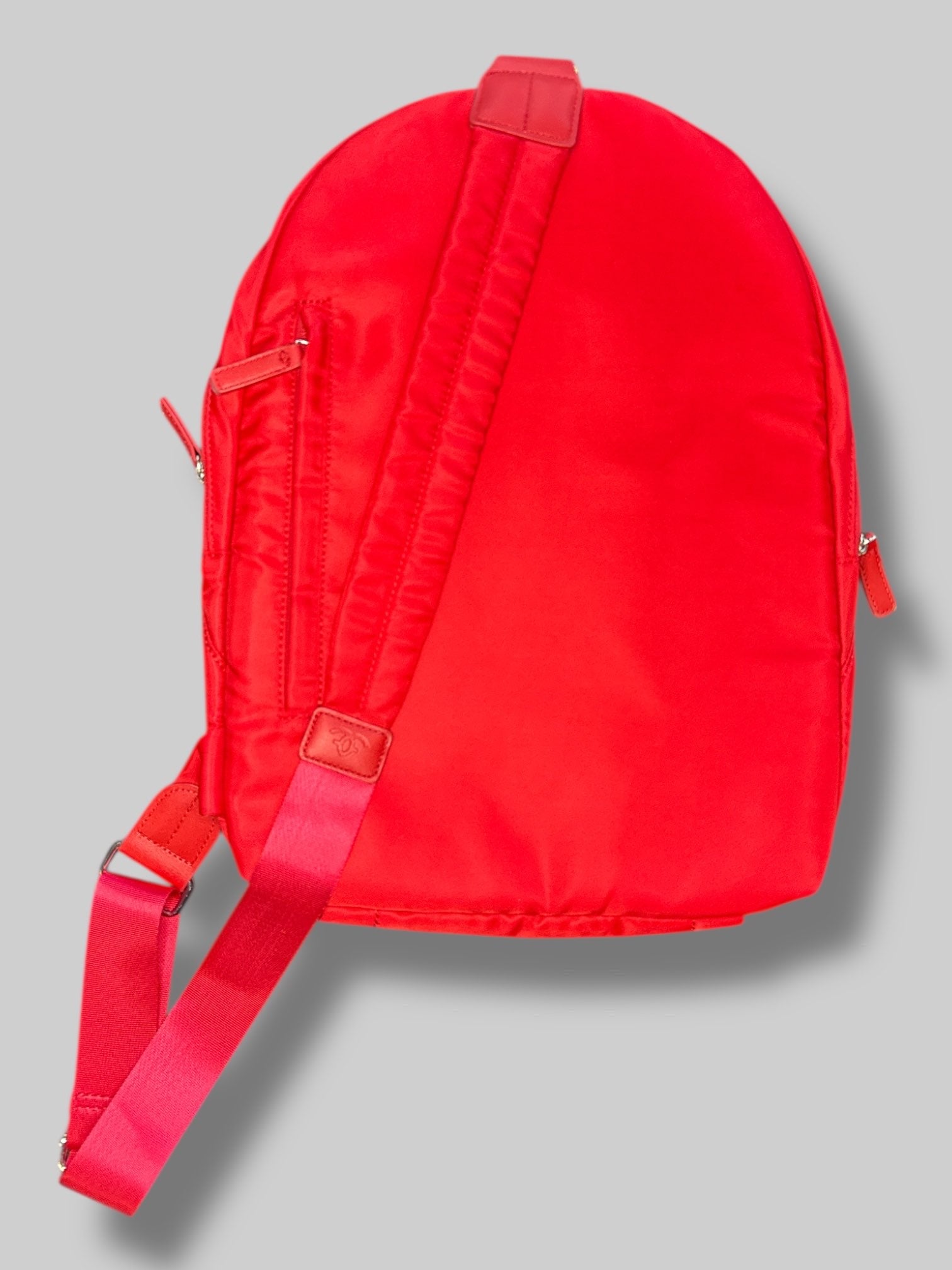 Francine Collections Red lightly padded laptop backpack with one adjustable strap and many zipper pockets