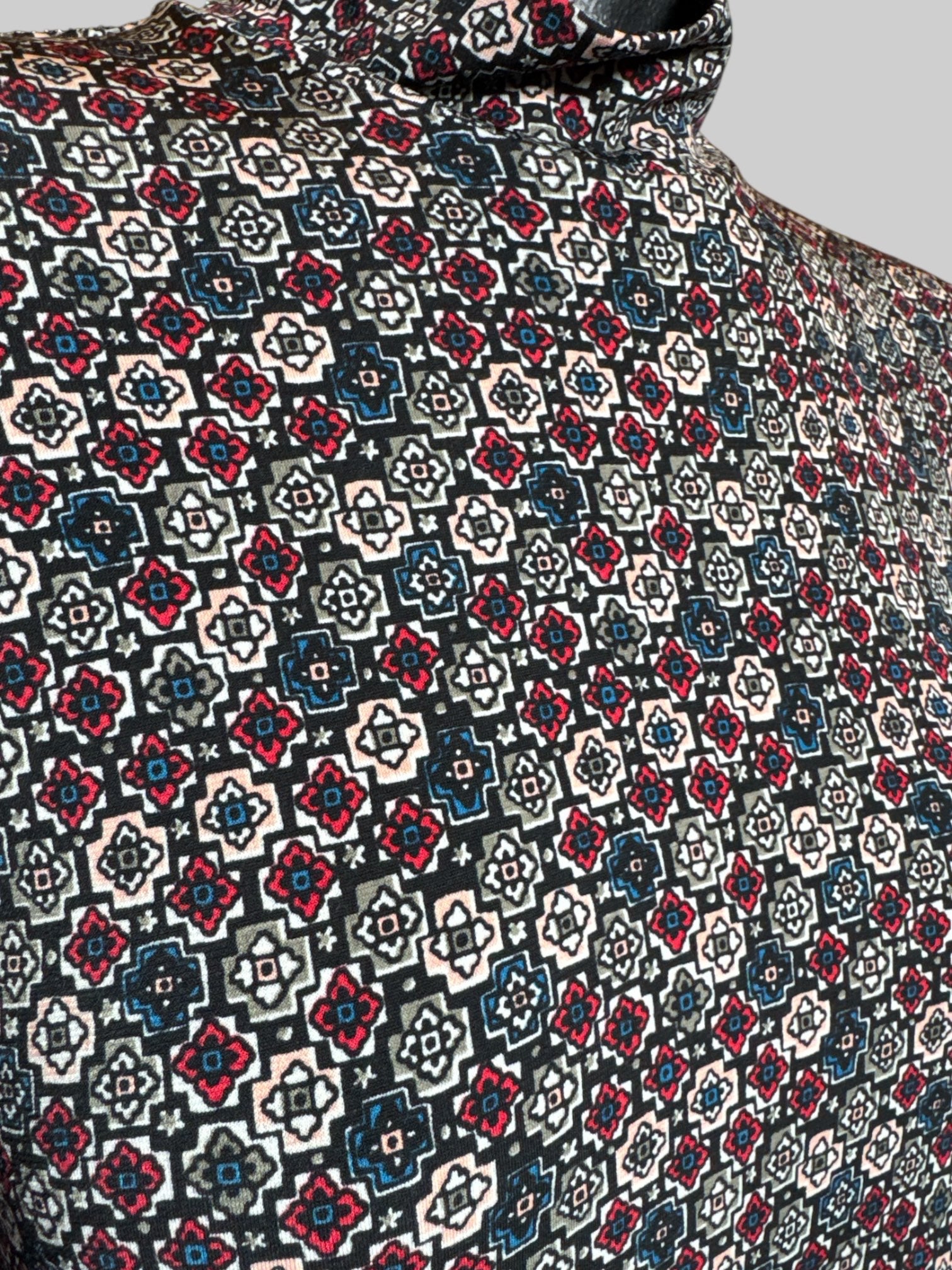 S BCBGeneration black short sleeve short dress with multicolor geometric pattern, star motifs, and mock neck