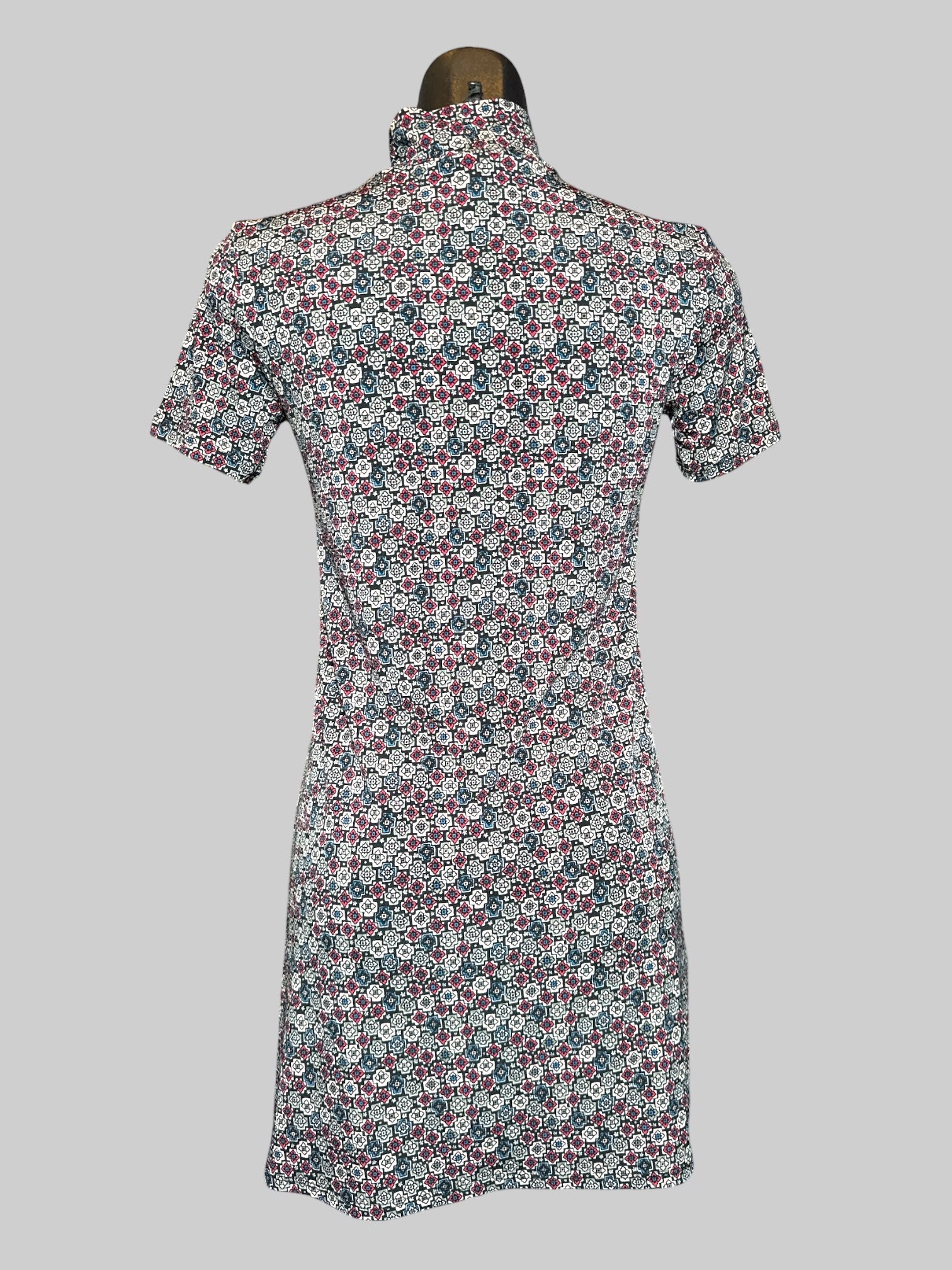 S BCBGeneration black short sleeve short dress with multicolor geometric pattern, star motifs, and mock neck