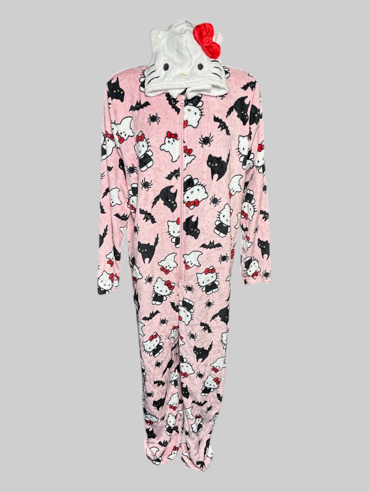 L Hello Kitty pink fluffy onesie with elastic foot cuffs, Hello Kitty hood, and spooky graphics