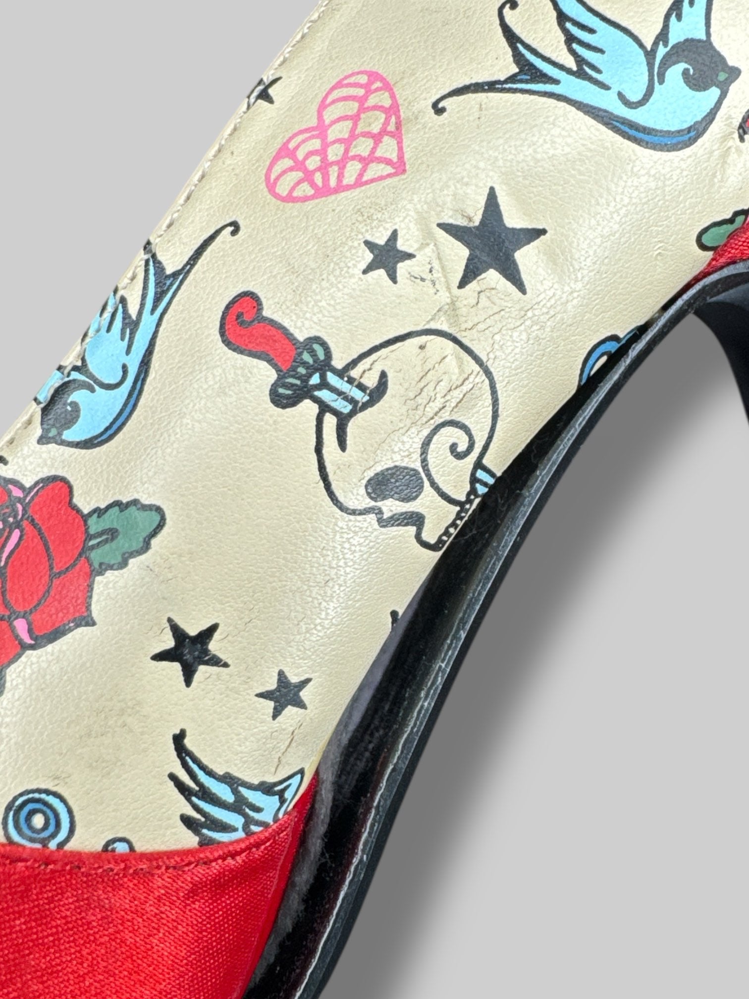 Size 6 Pin Up Couture tan stiletto heels with traditional tattoo designs, and bows on toes