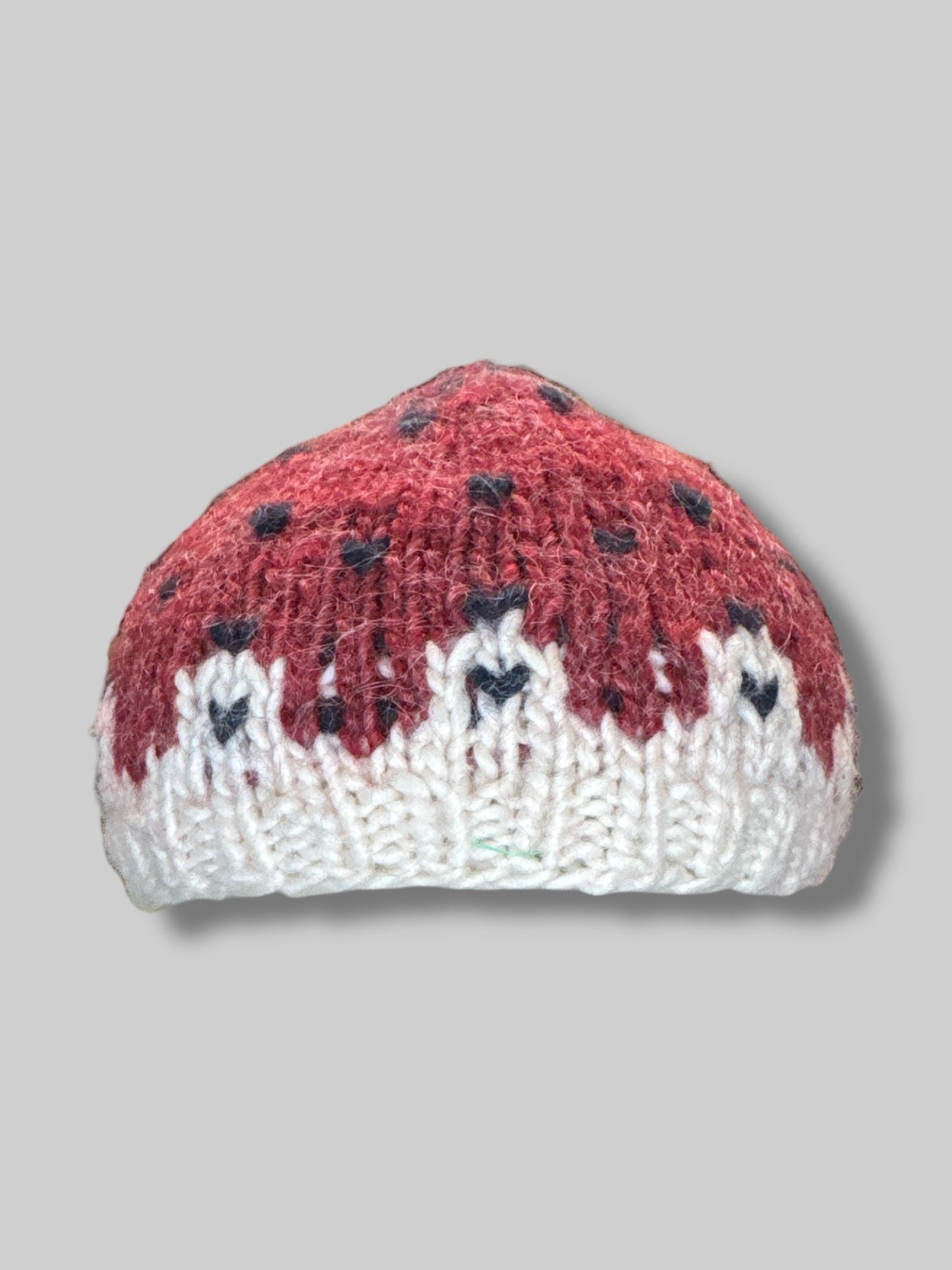 Red and white knit strawberry hat
