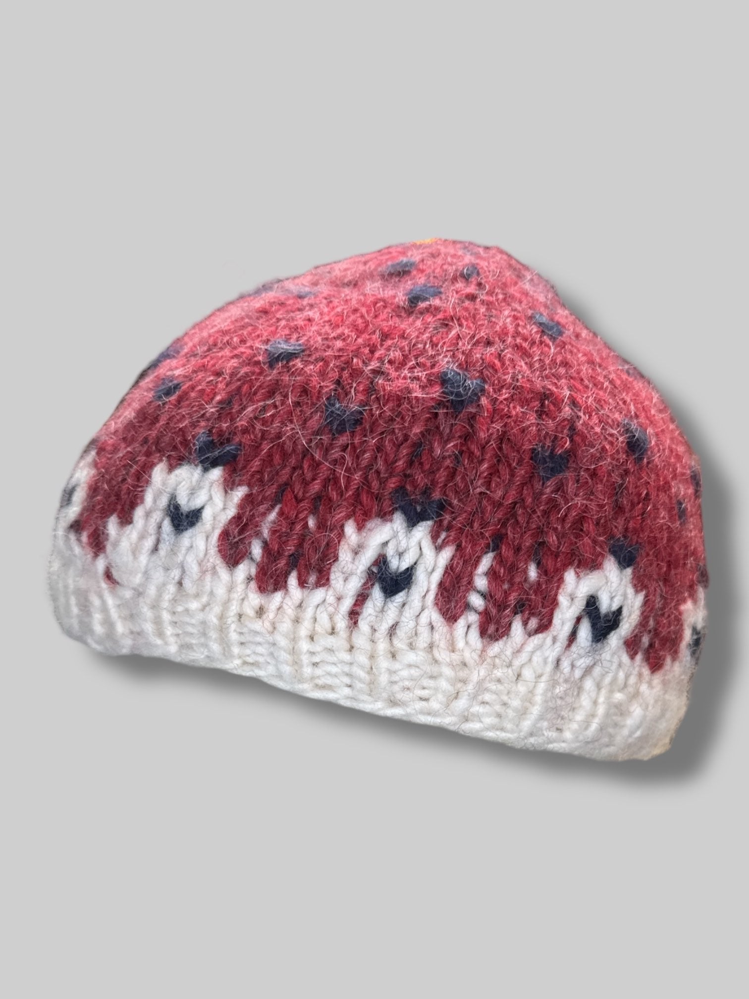 Red and white knit strawberry hat