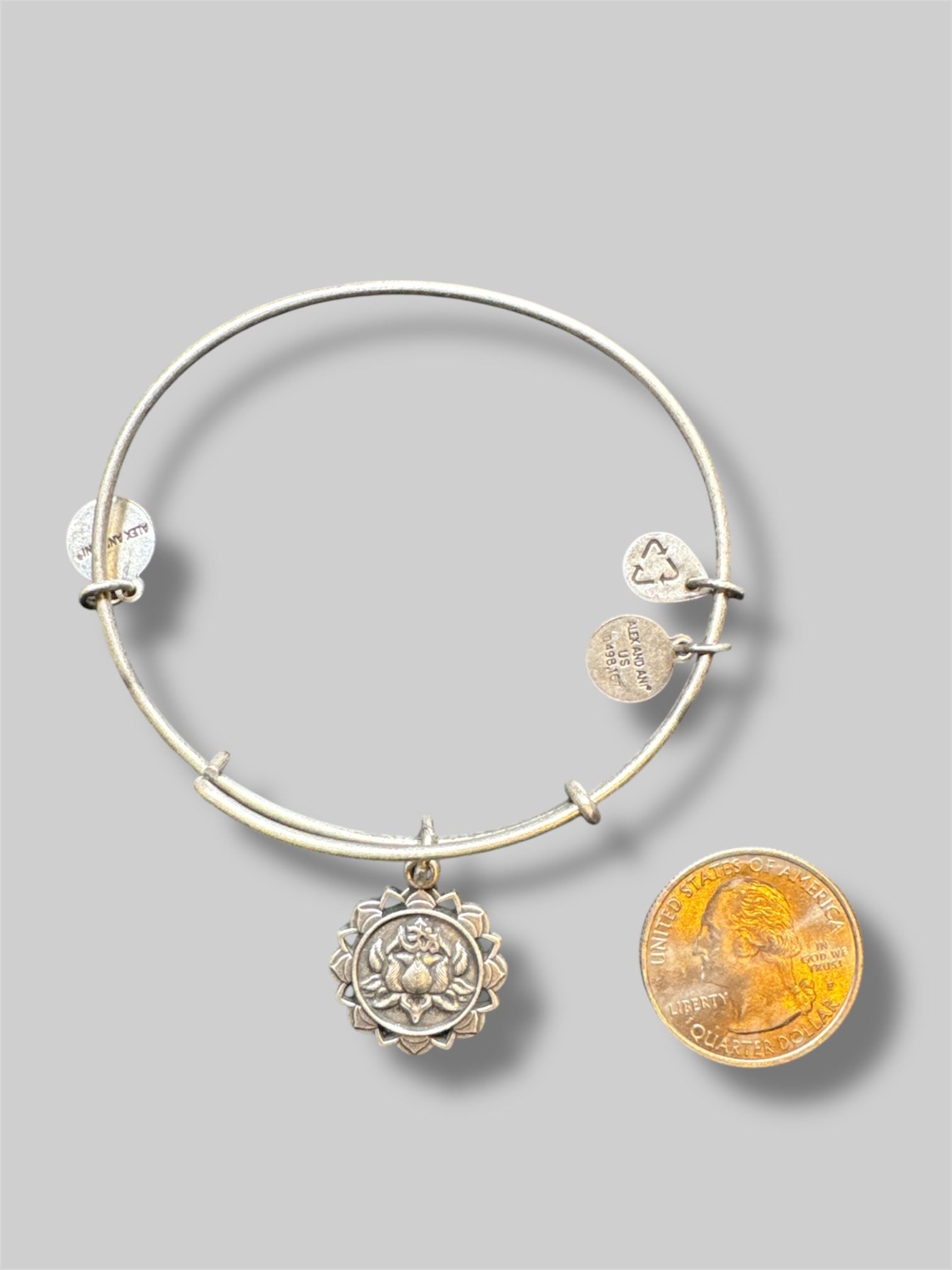 Stack of 5 different Alex and Ani bracelets