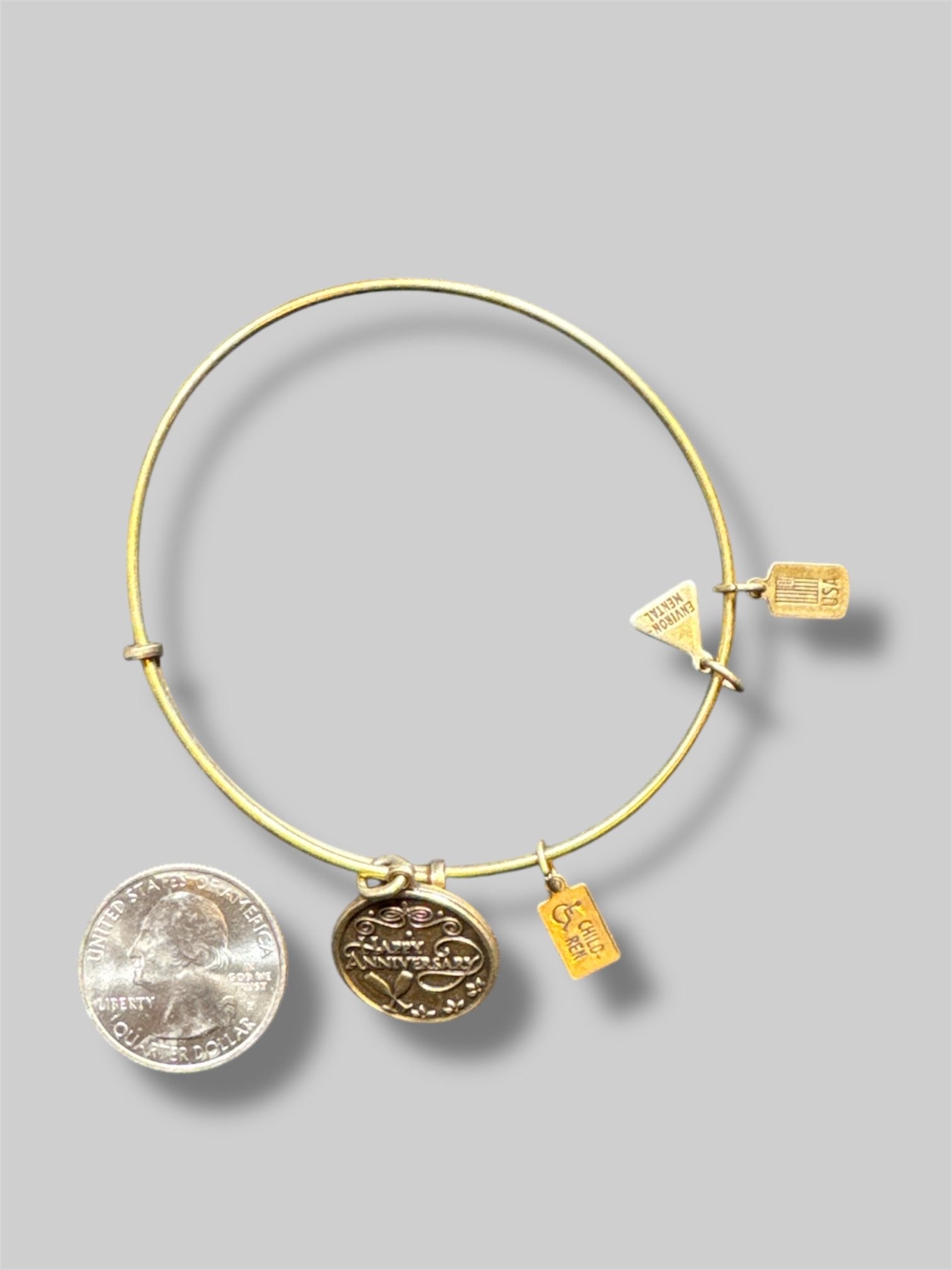 Stack of 5 different Alex and Ani bracelets
