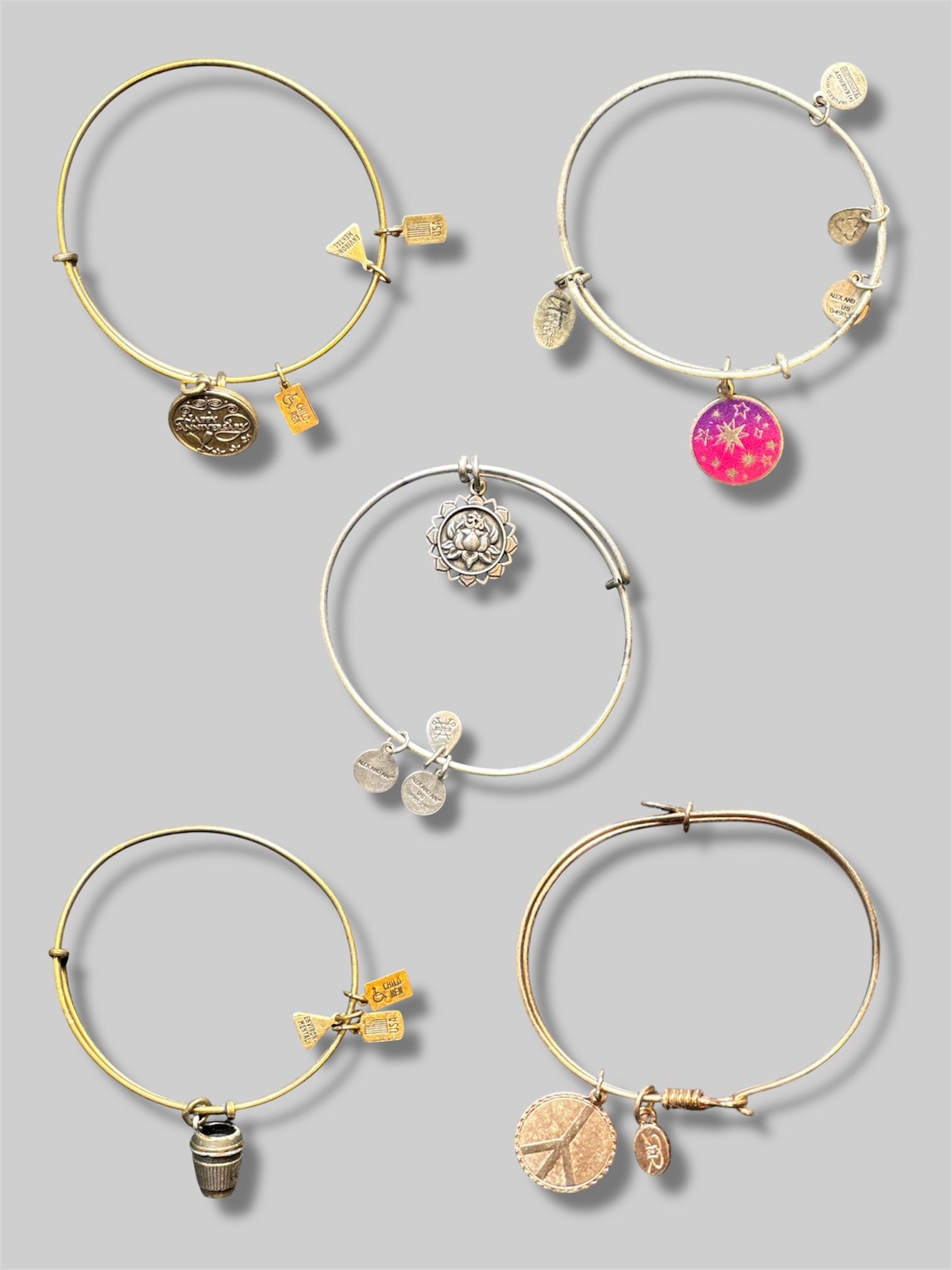 Stack of 5 different Alex and Ani bracelets
