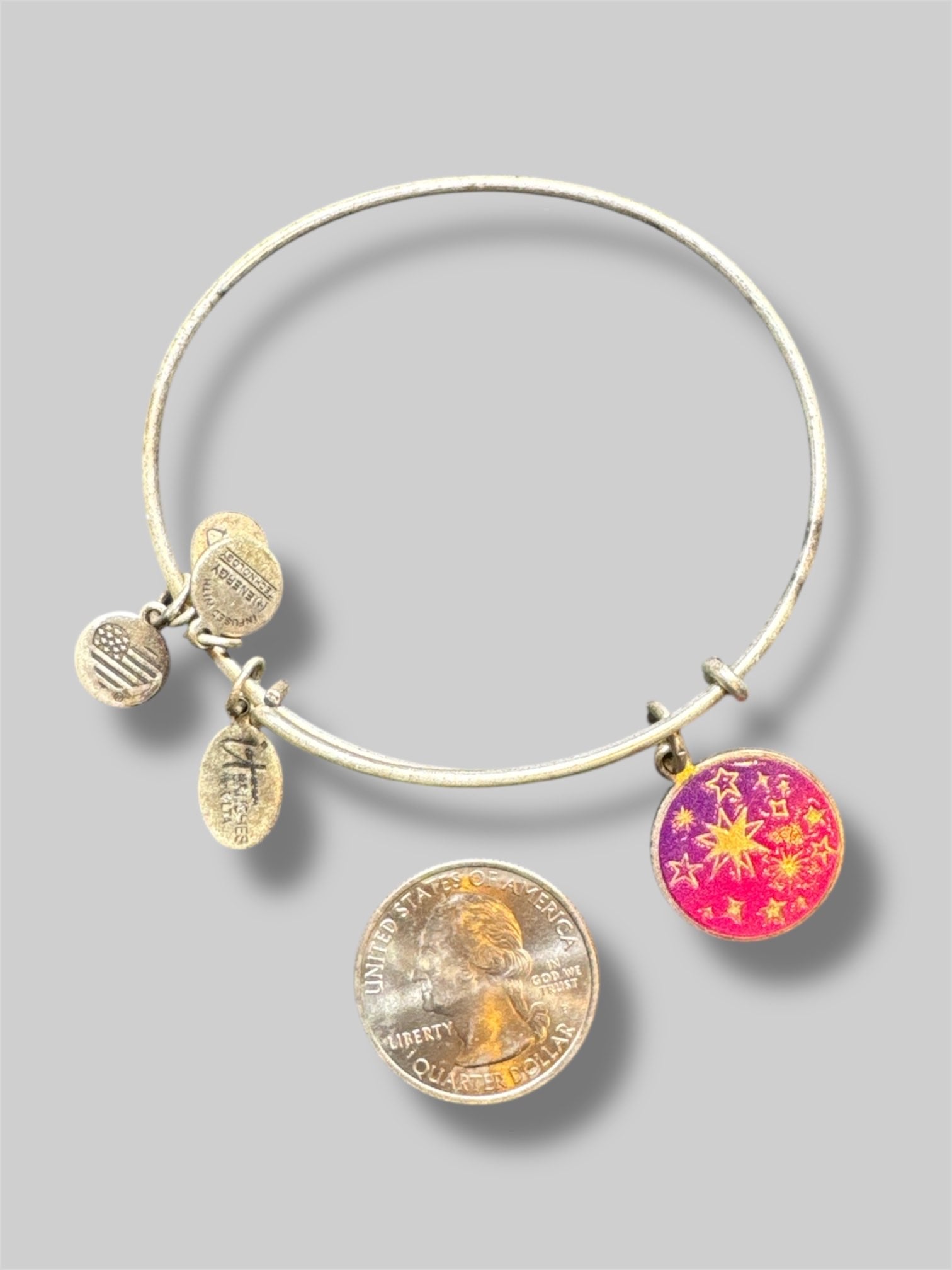 Stack of 5 different Alex and Ani bracelets