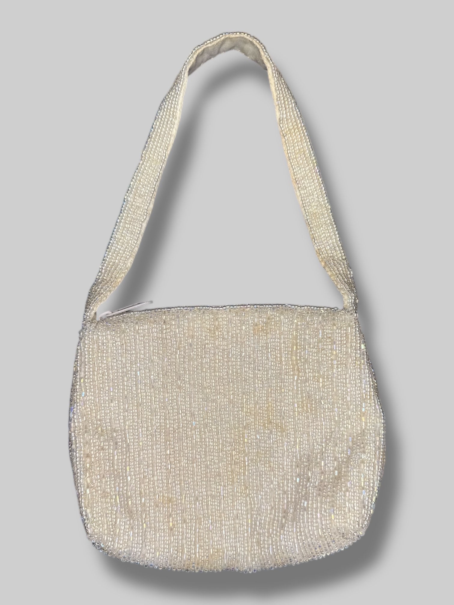 10.5” vintage handbag with iridescent beading, and zipper closure