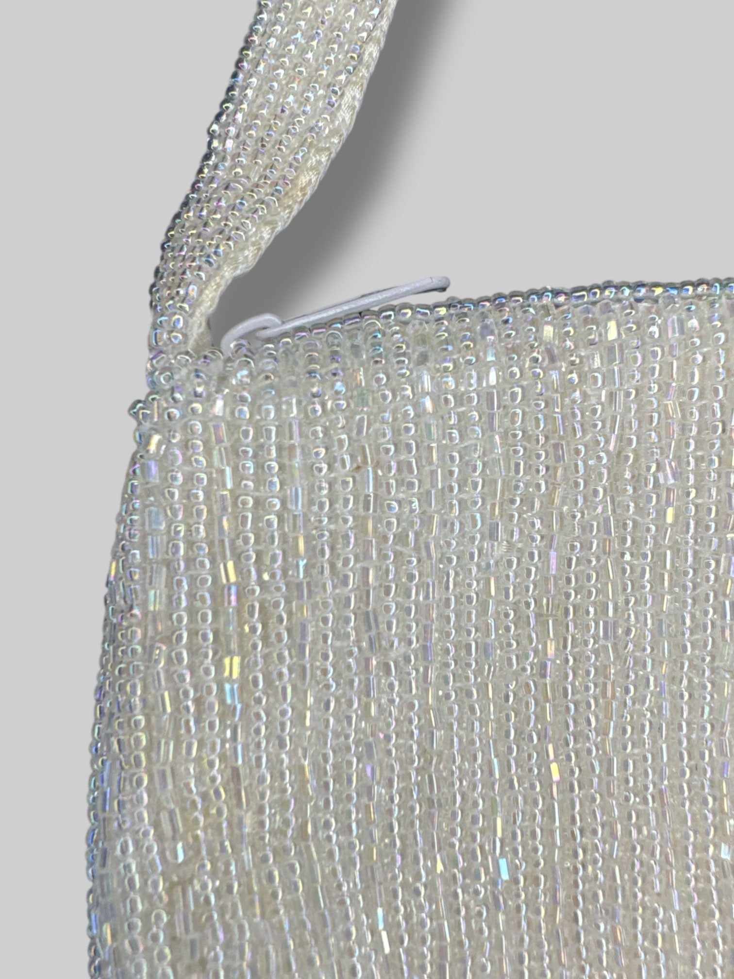 10.5” vintage handbag with iridescent beading, and zipper closure