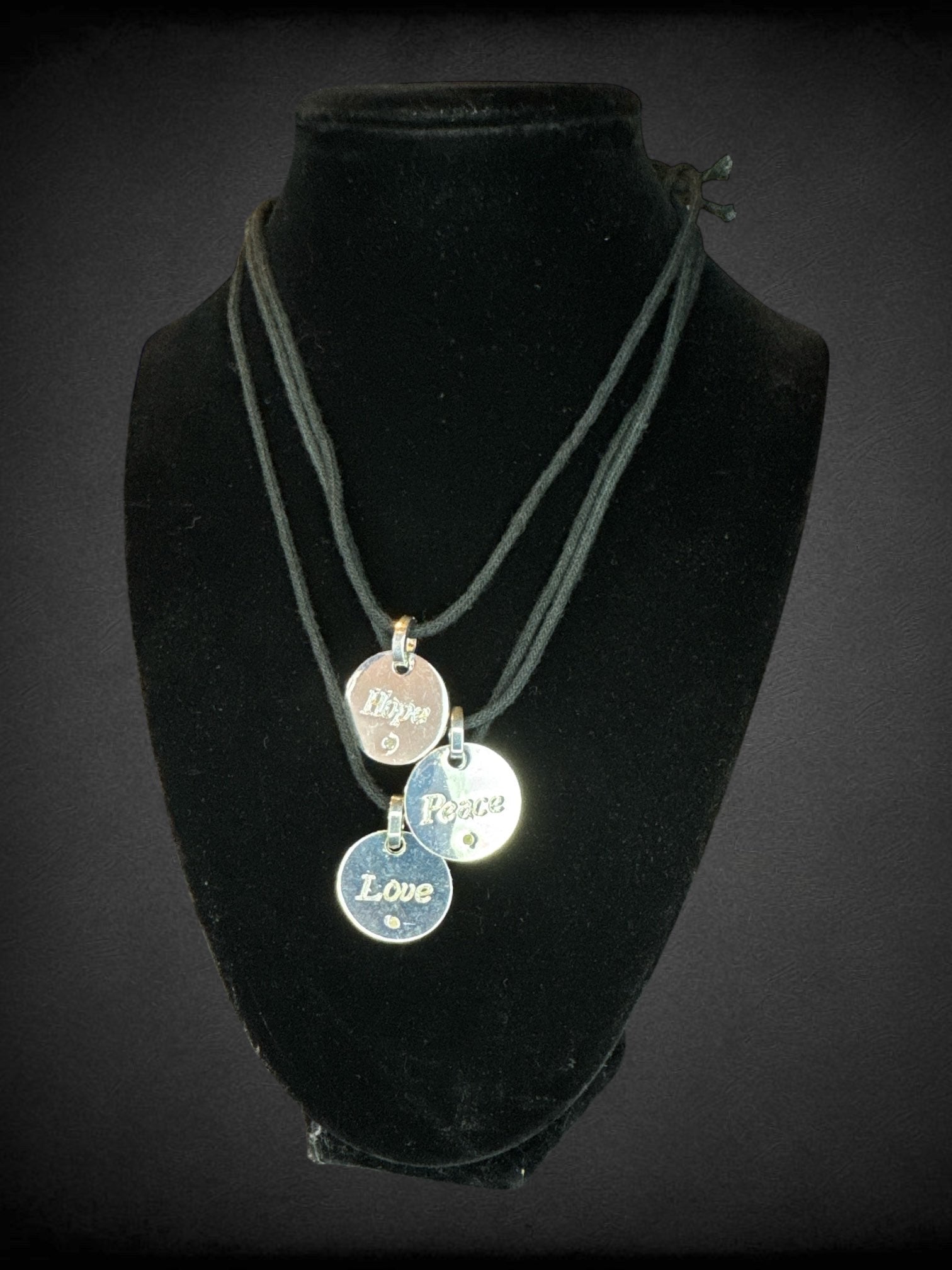 Set of 3 adjustable silver metal pendant necklaces with “Hope, Peace, Love” messages
