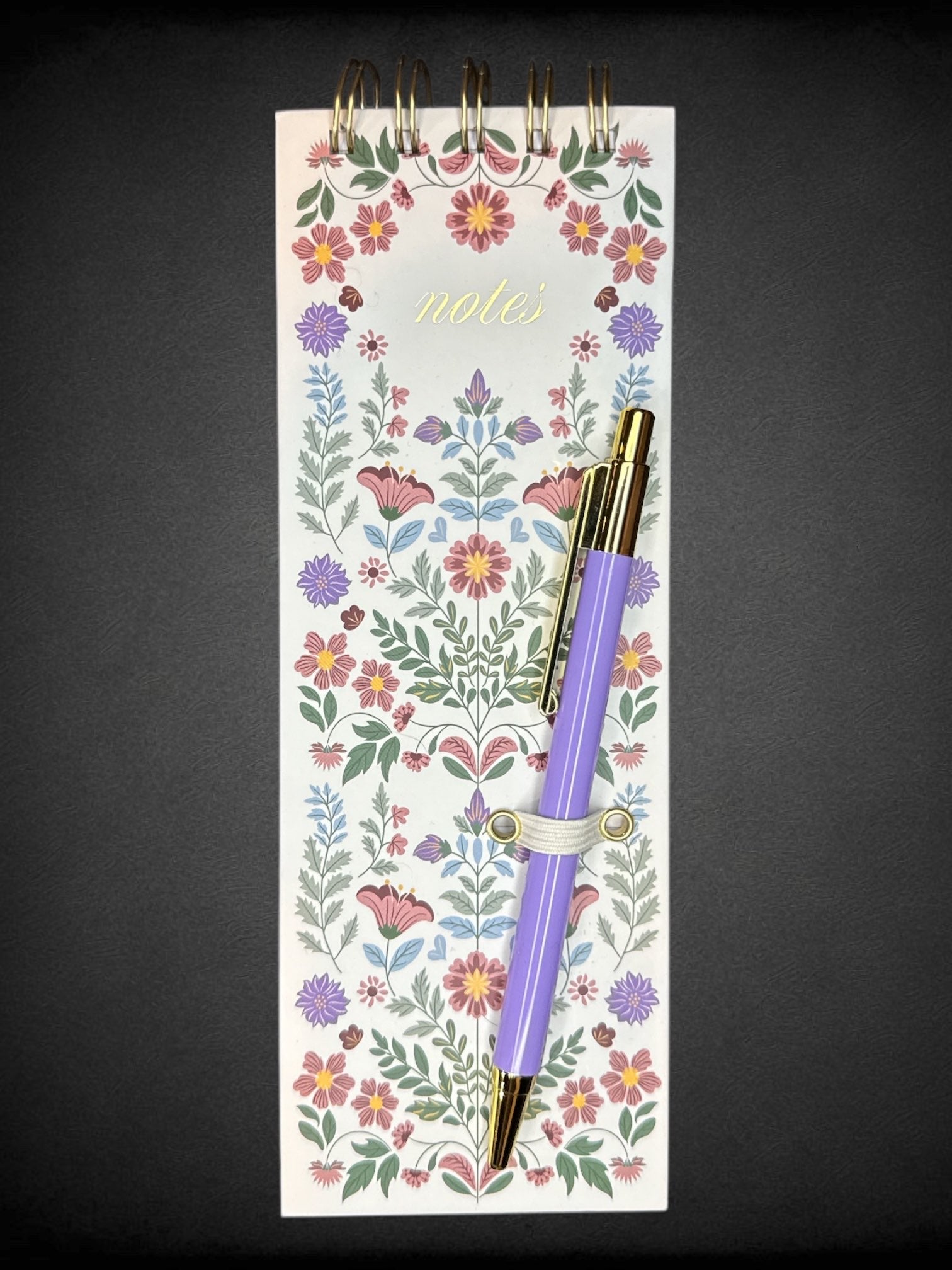 White long notepad with floral design and included pen