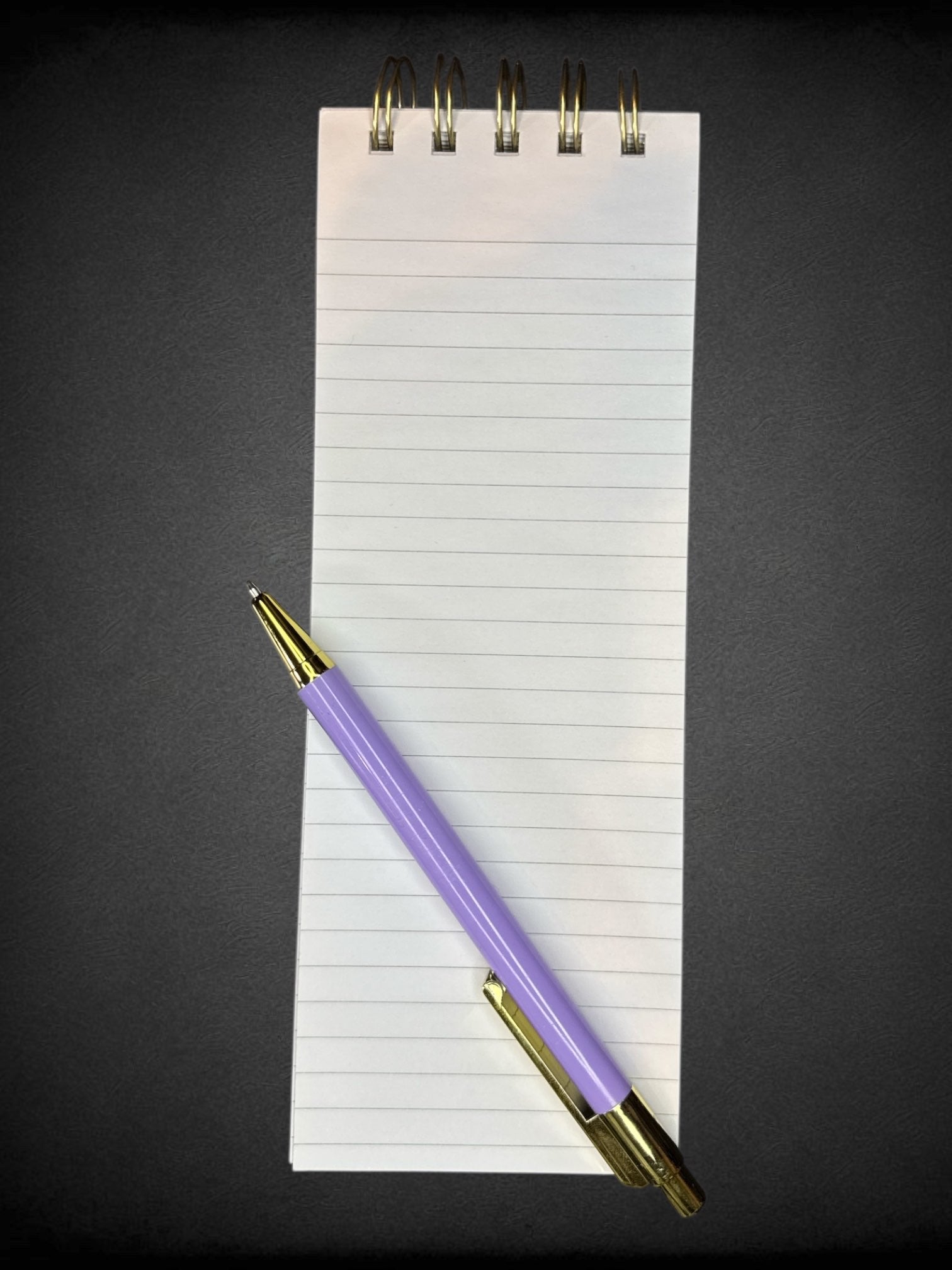 White long notepad with floral design and included pen