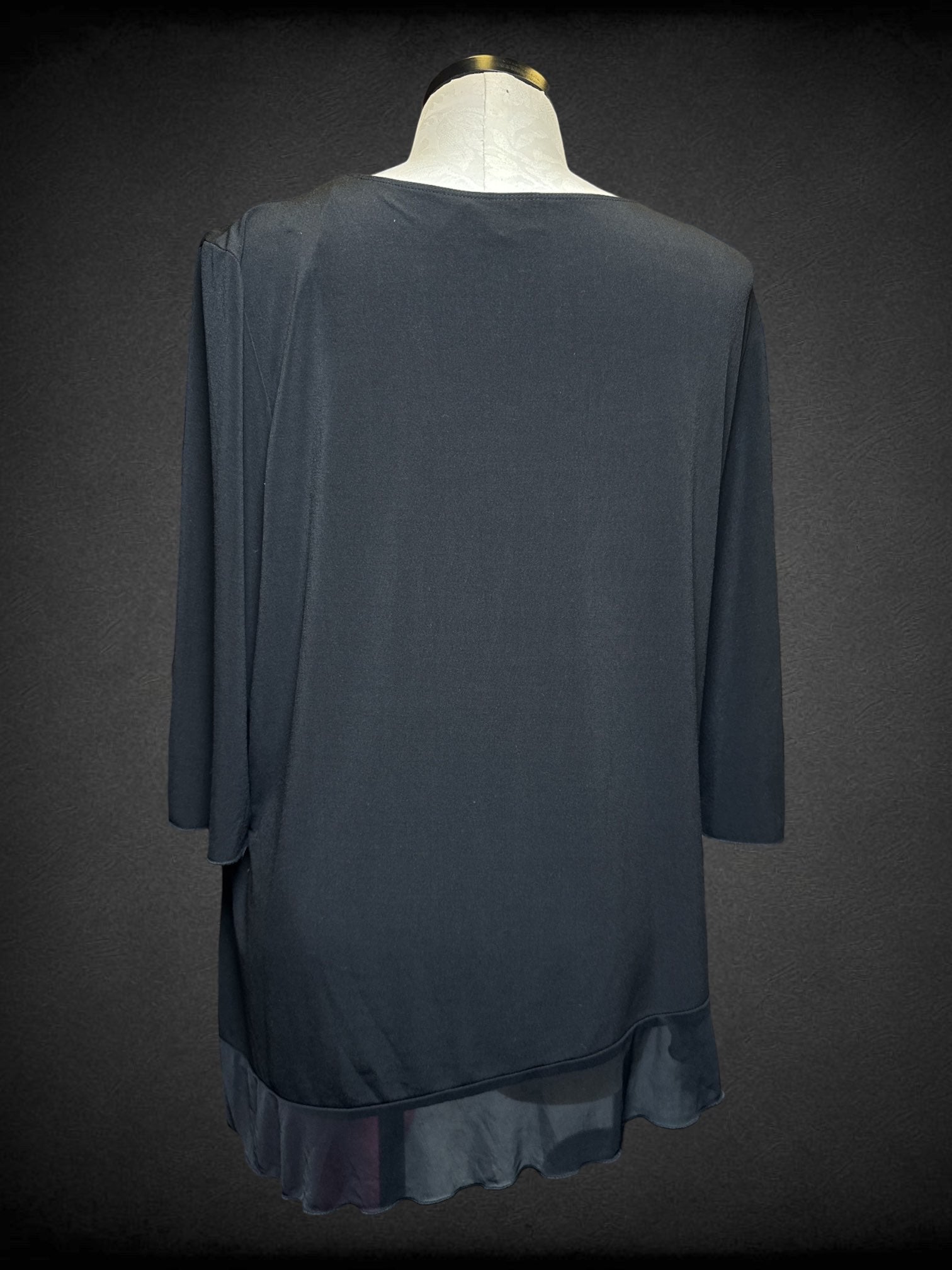 4X Fashion Bug black flowy blouse with 3D flower and sheer asymmetrical trim