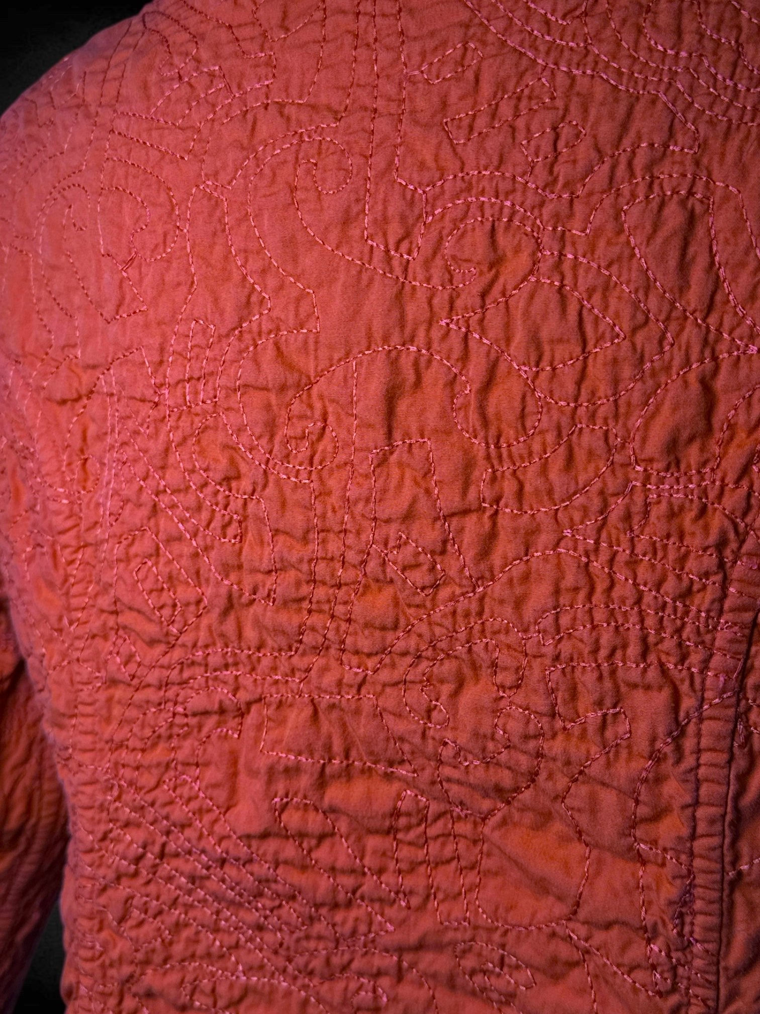 M Red-orange reversible quilted jacket with yellow and green accents