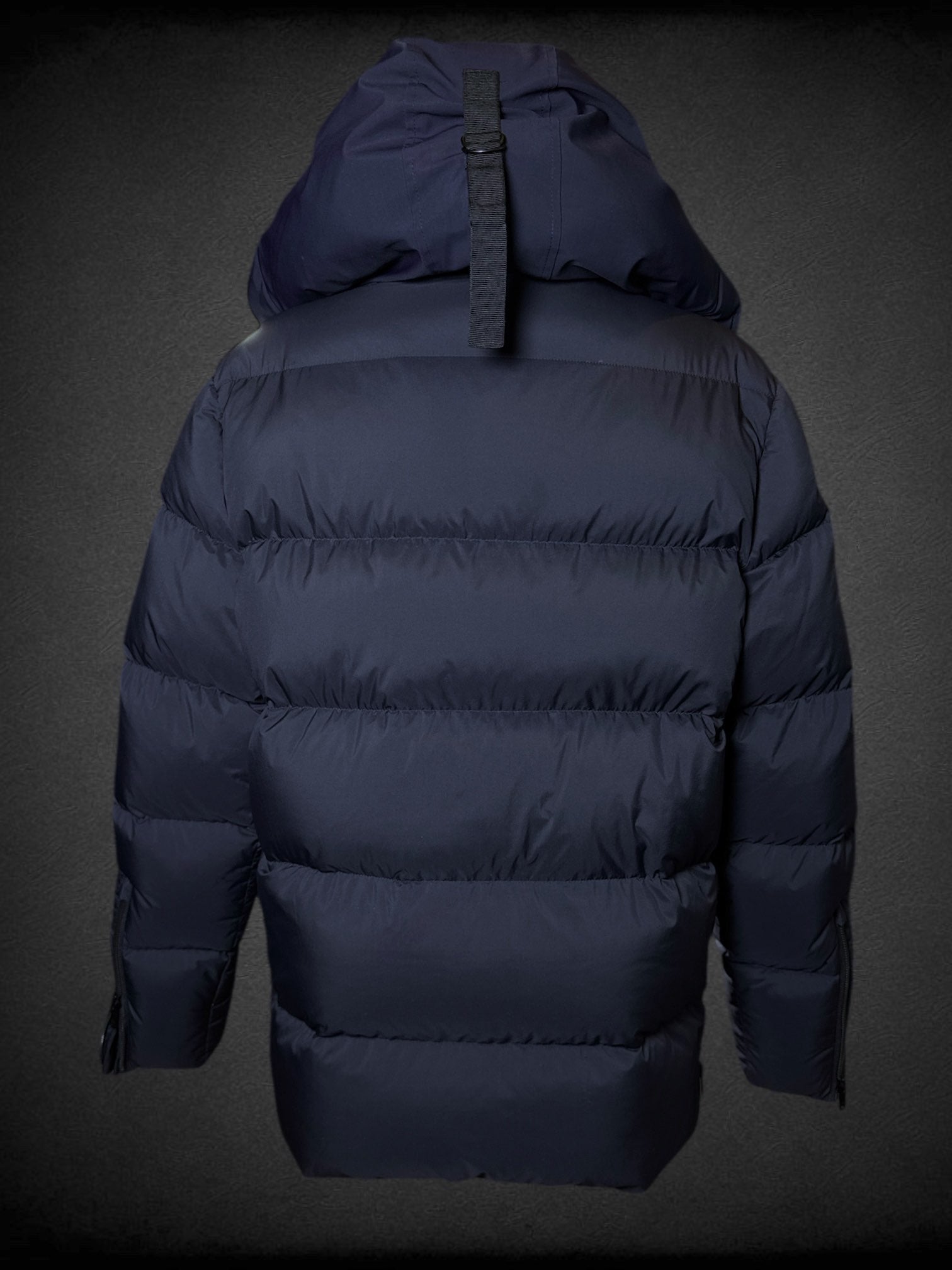 L Moose Knuckles dark blue puffer coat with zipper and snap button pockets, decorative slipper shaped like axe, and logo on sleeve