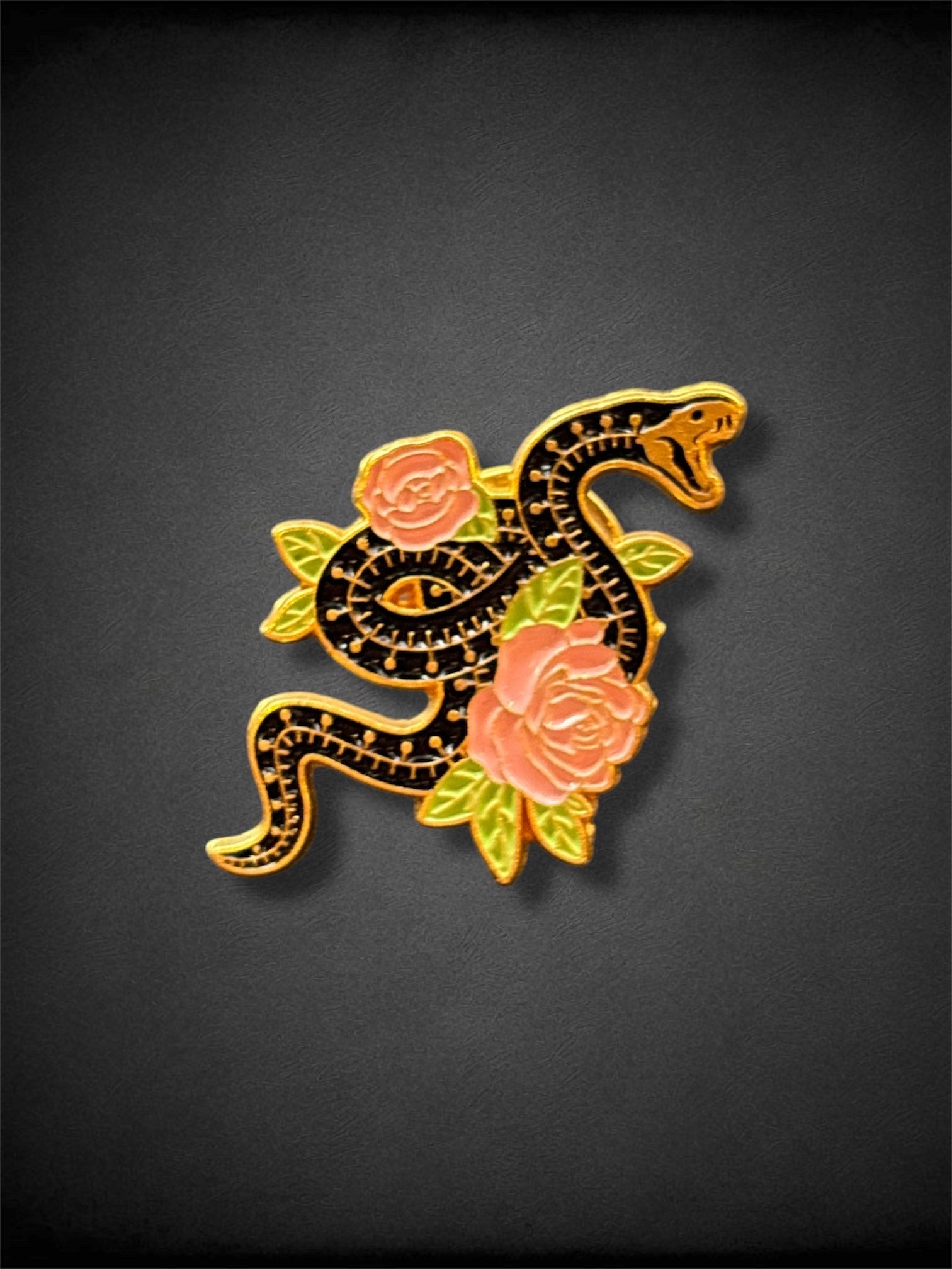 Black skeletal snake and flowers pin