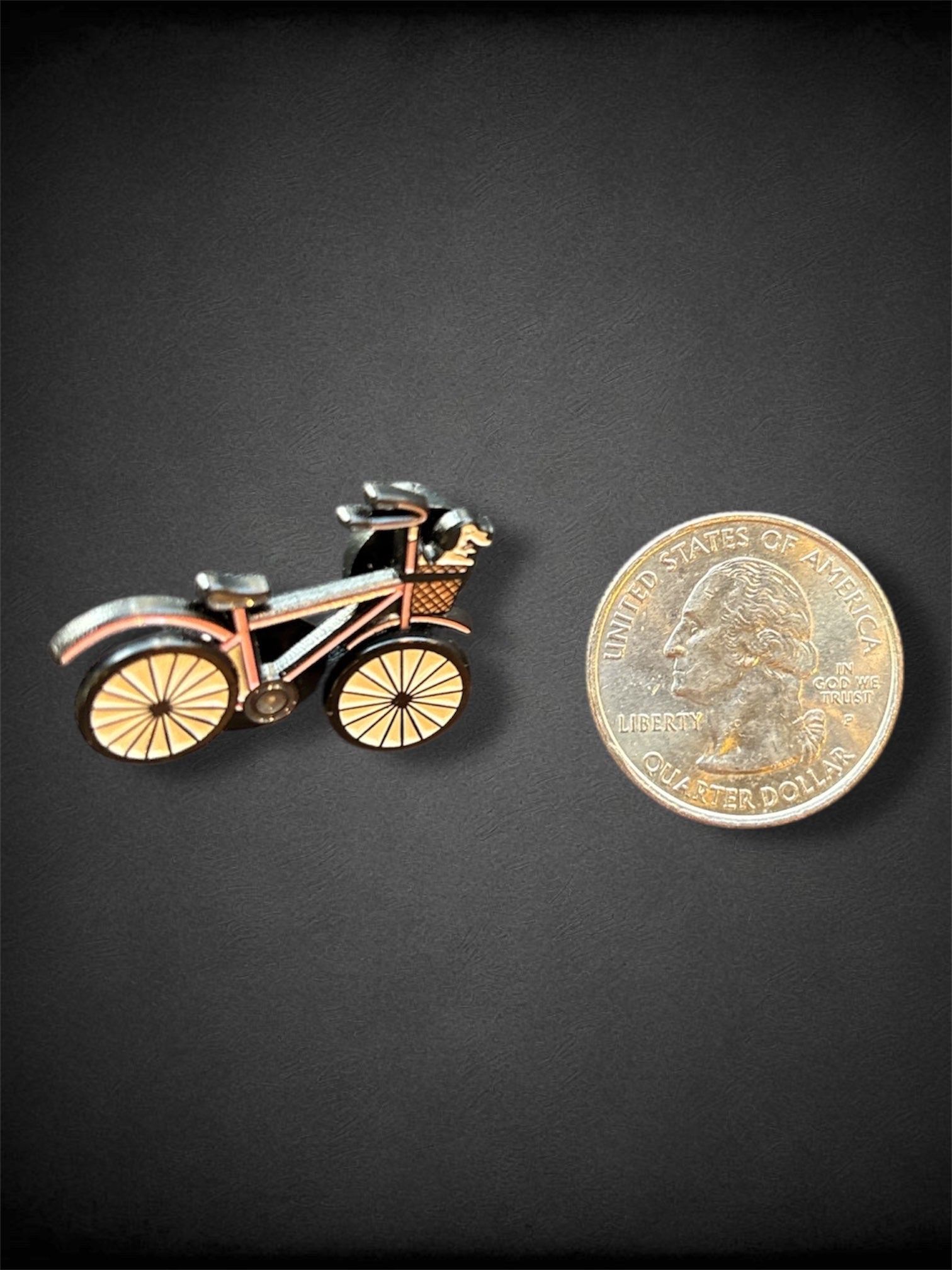 Pink bike with rotating wheels pin