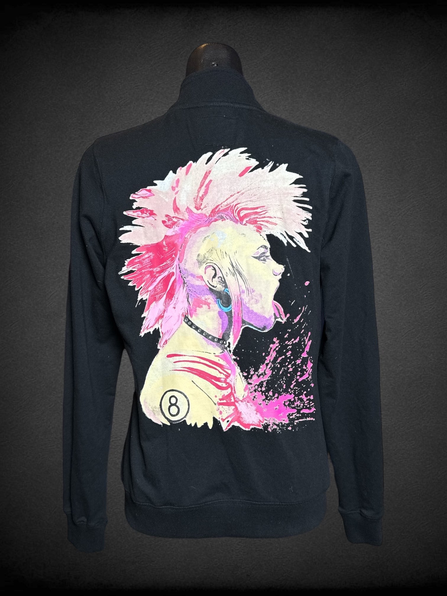 L Iron Fist black long sleeve zip up jacket with pink mohawk punk graphic, and British pins on front