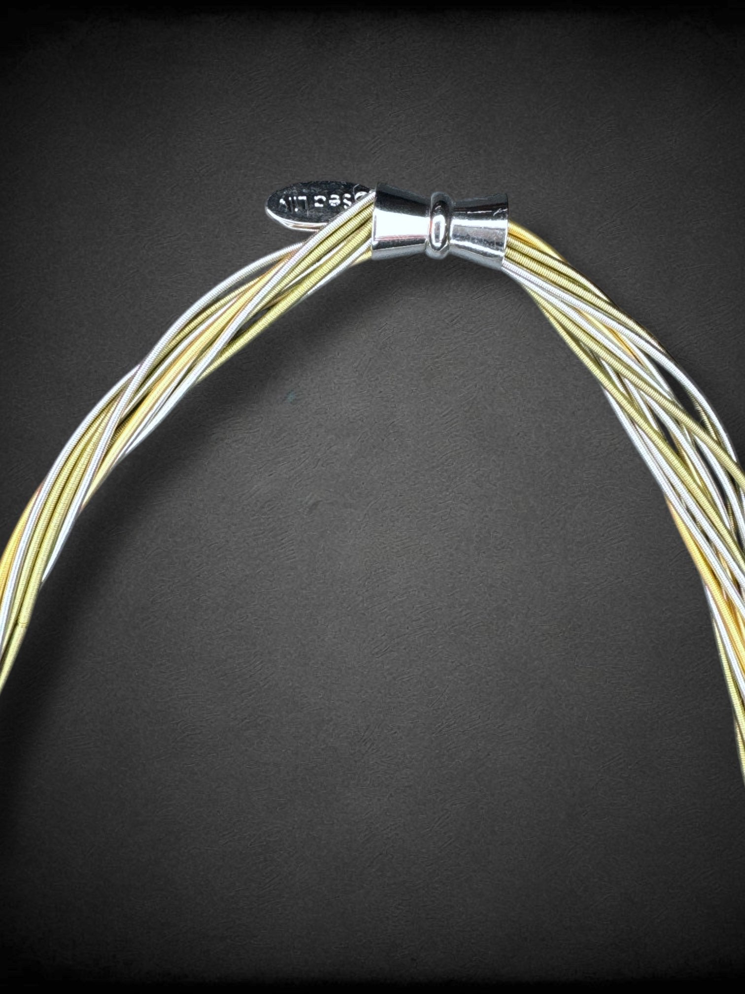 Sea Lily piano wire necklace with hammered silver tone pendant